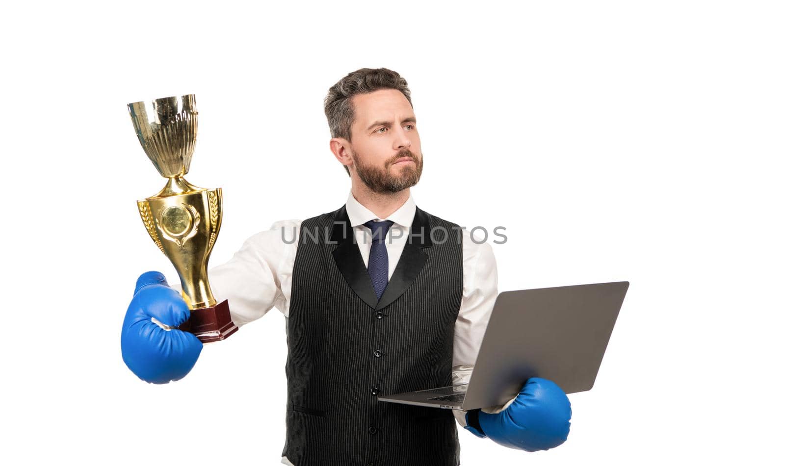 proud businessman in boxing gloves hold pc and champion cup isolated on white background, victory.