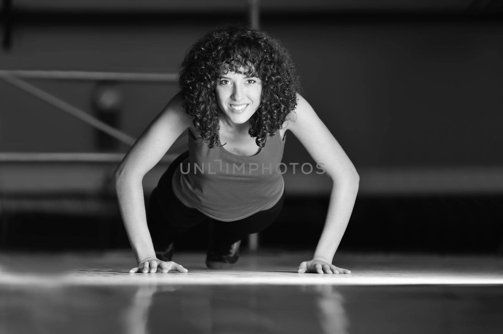 young woman practicing fitness and working out in a gym 