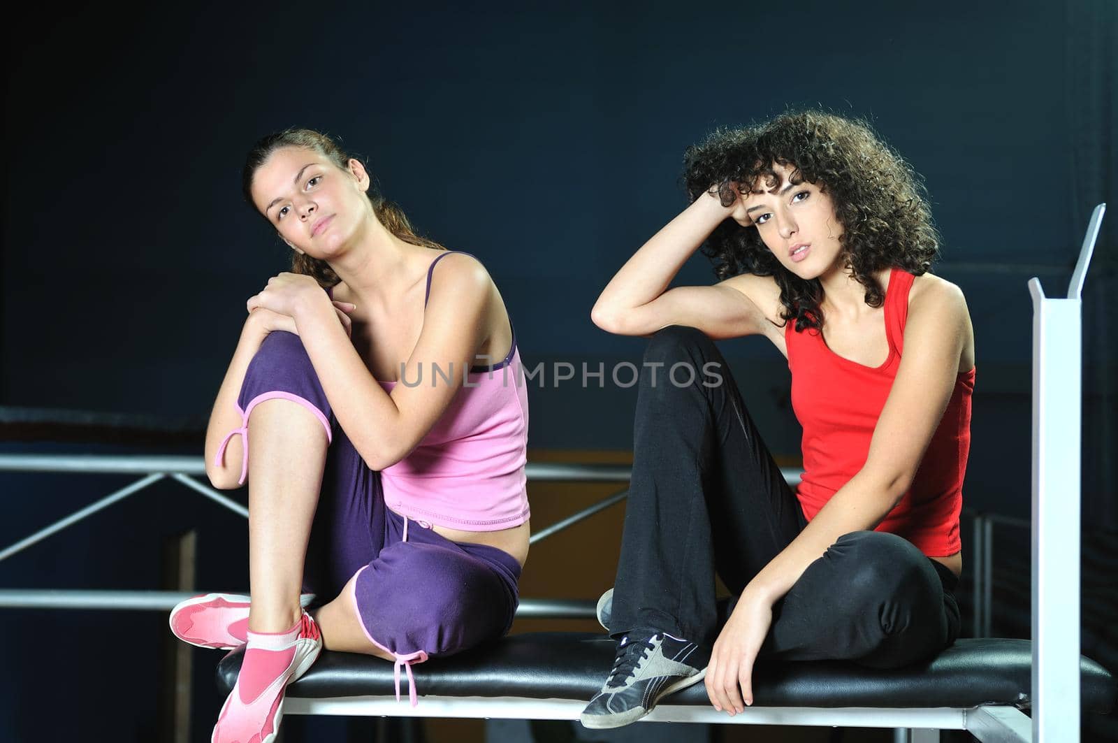 two women work out  in fitness club by dotshock