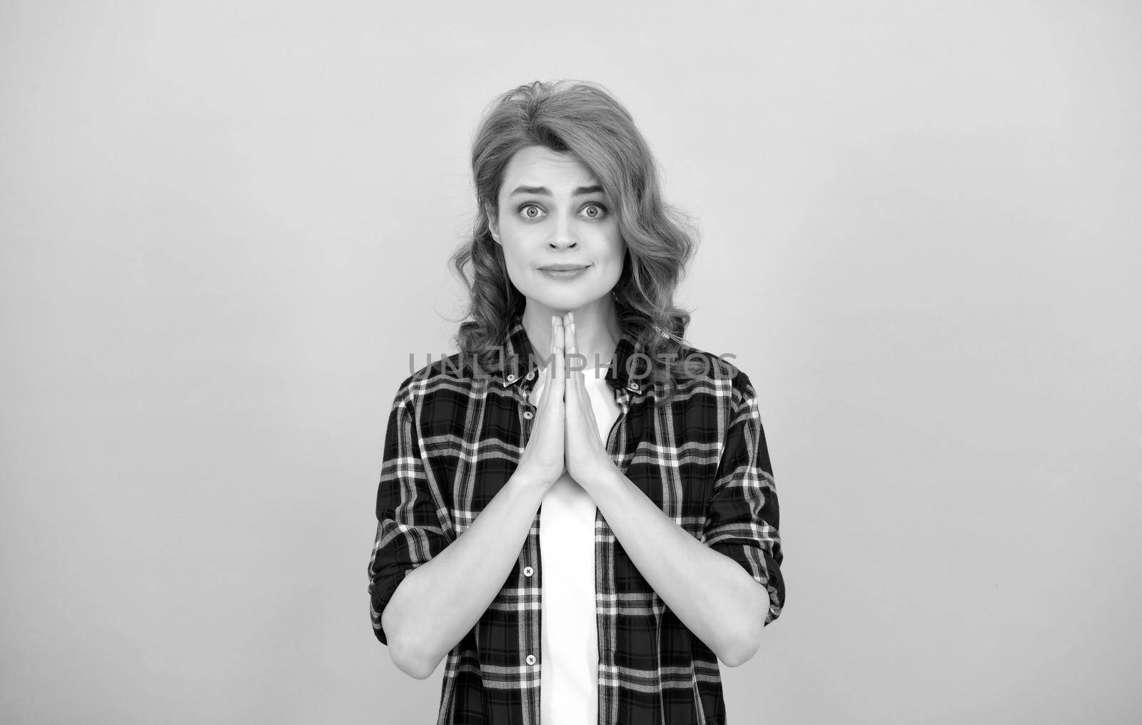 praying redhead woman in checkered shirt. express emotions. hoping lady with curly hair. fashion and beauty. female model casual trend. portrait look of young girl. red haired woman.