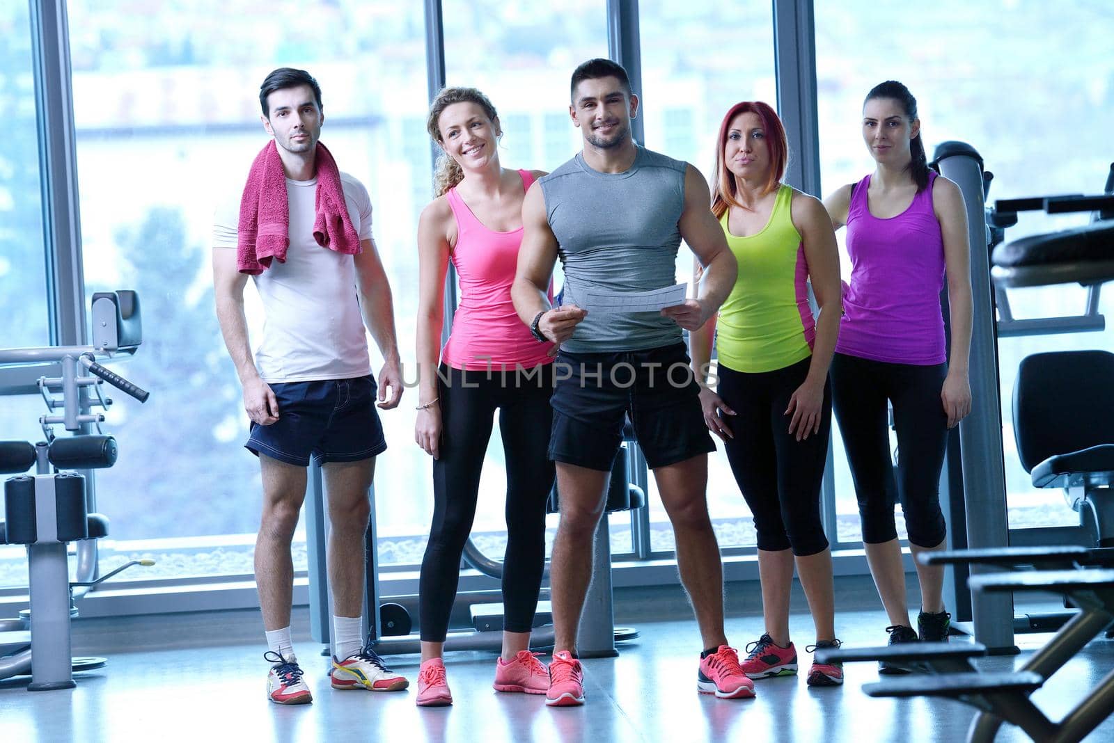 Group of people exercising at the gym by dotshock