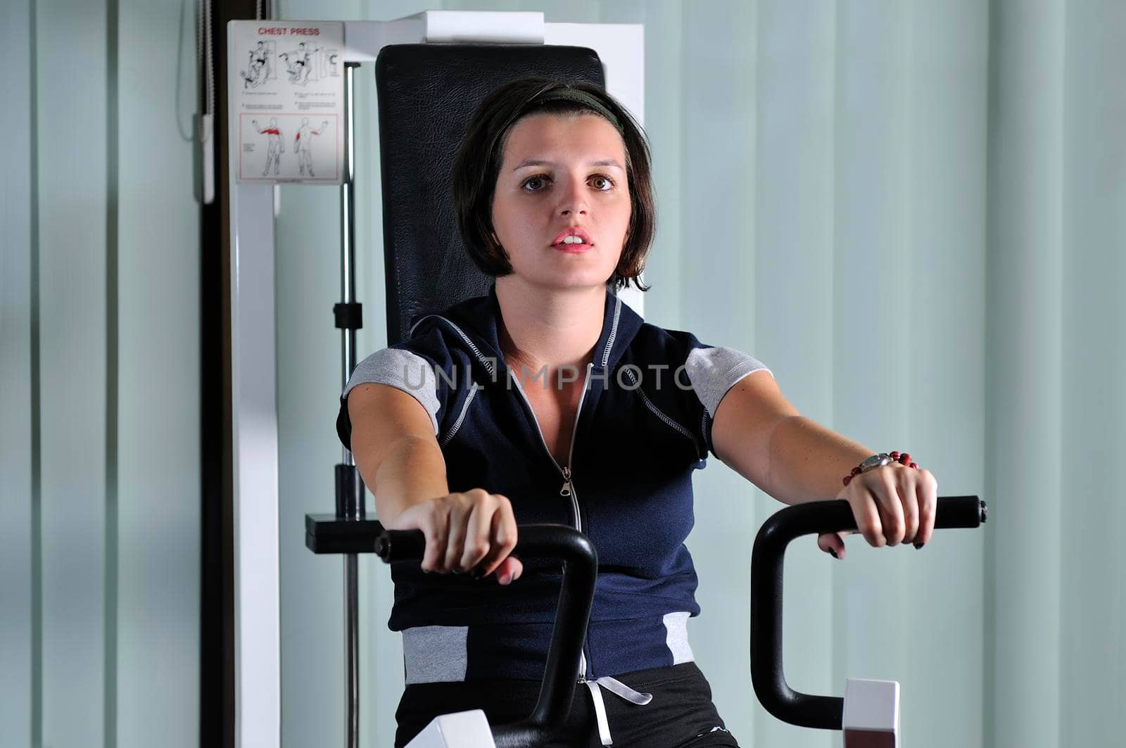 young  woman work out in fitness by dotshock