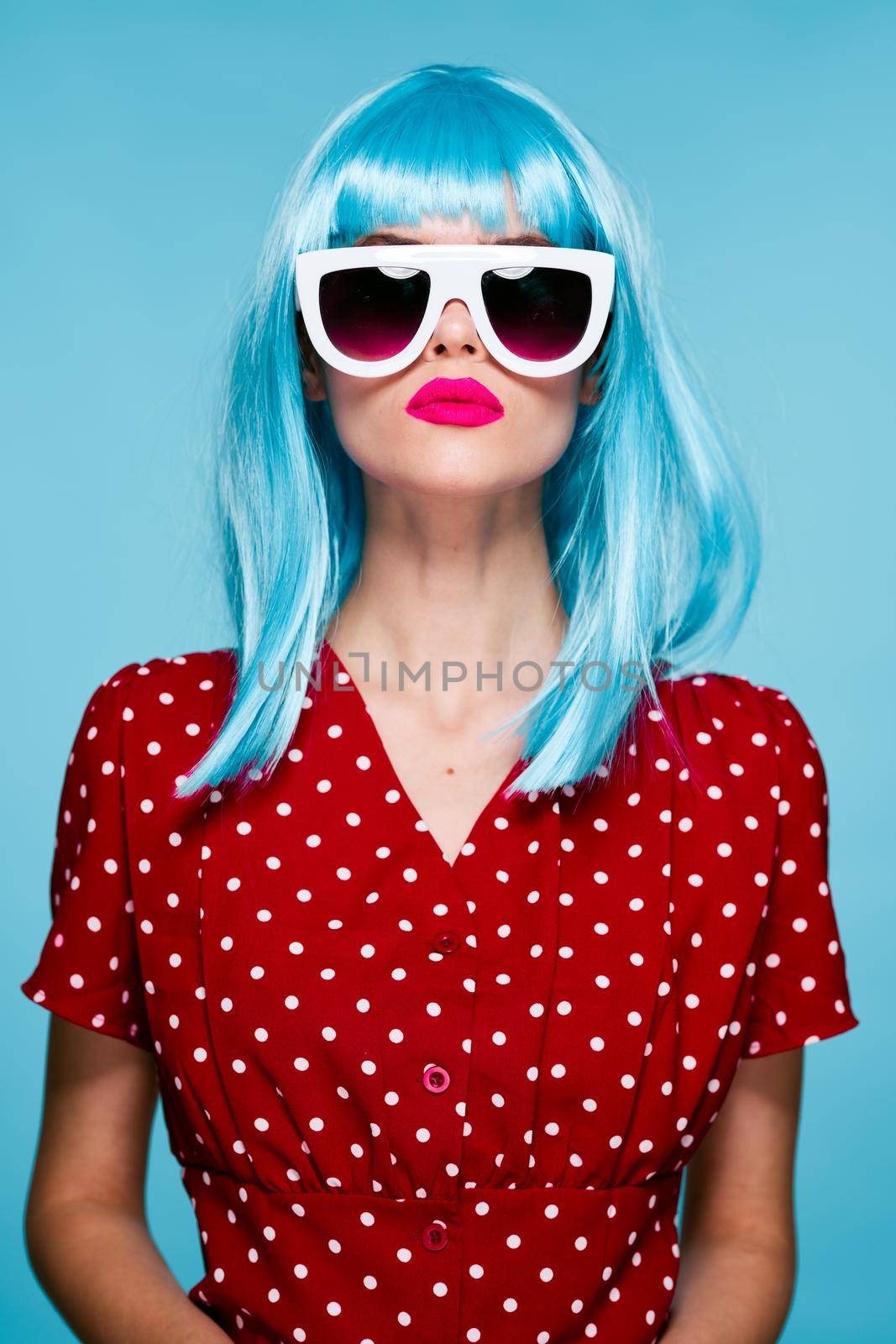 pretty woman fashion blue wig posing sunglasses. High quality photo