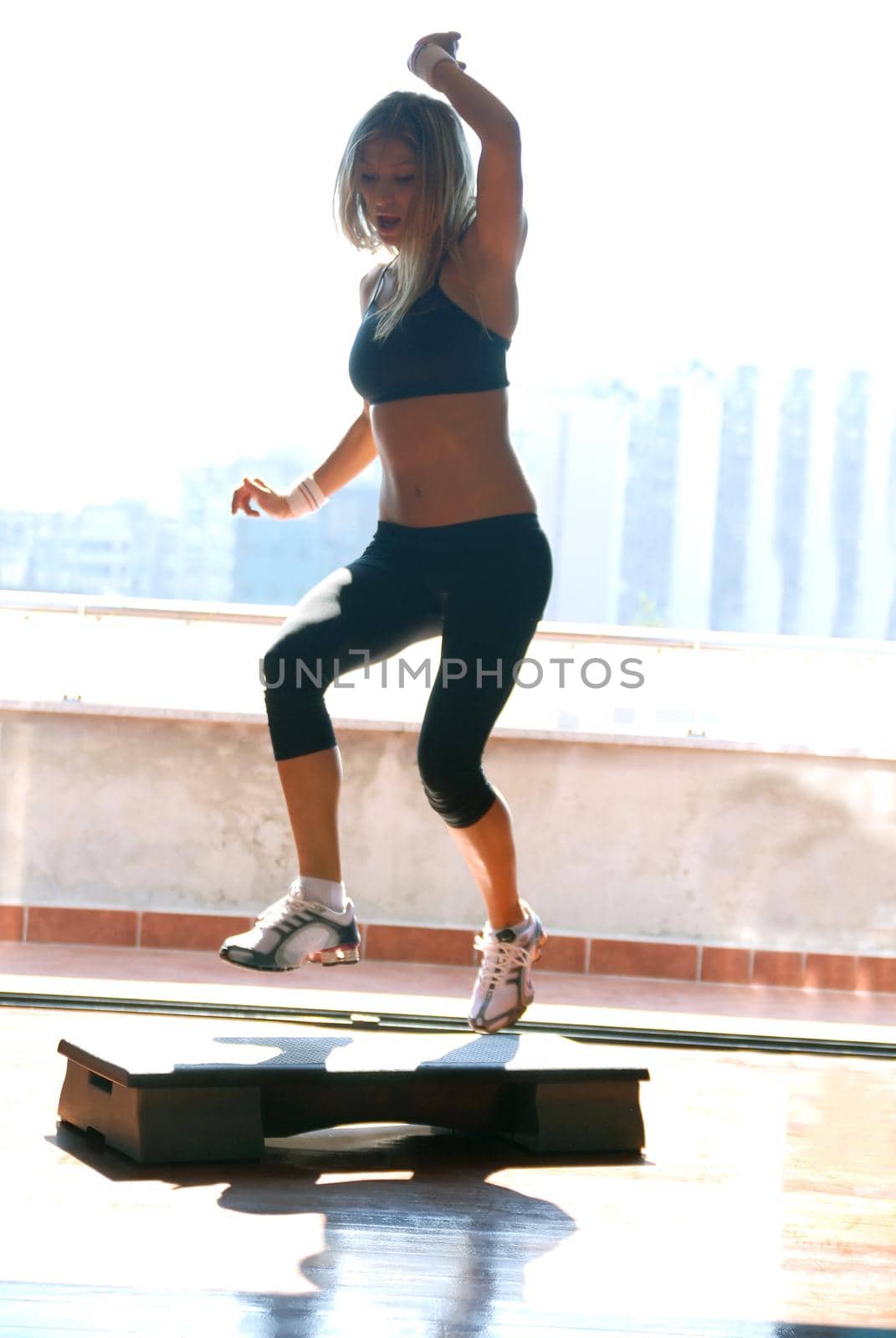 women stepping in a fitness center 