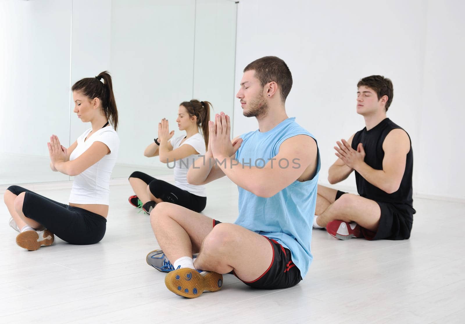 young people group in fitness club by dotshock