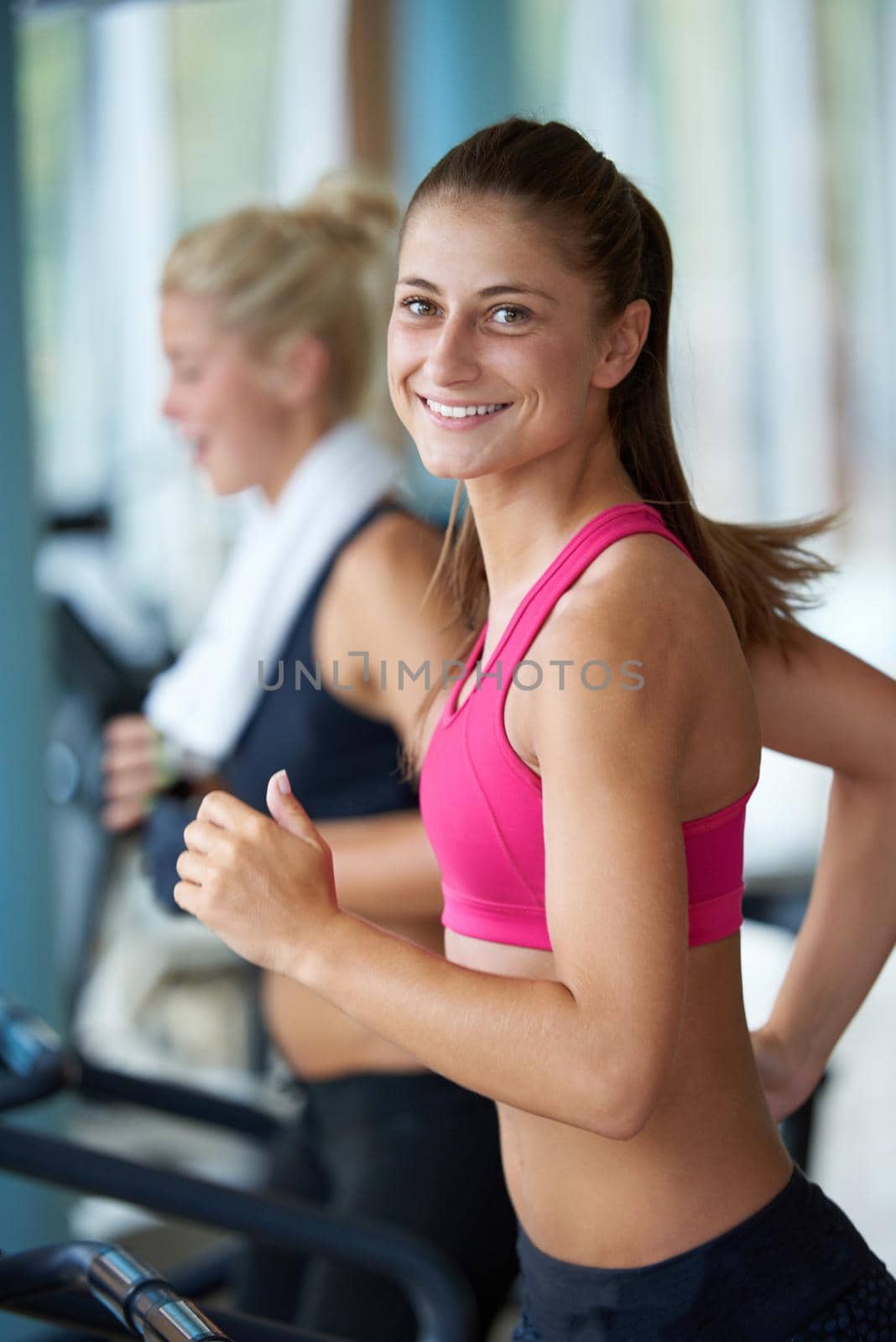 sport, fitness, lifestyle, technology and people concept - smiling woman exercising on treadmill in gym