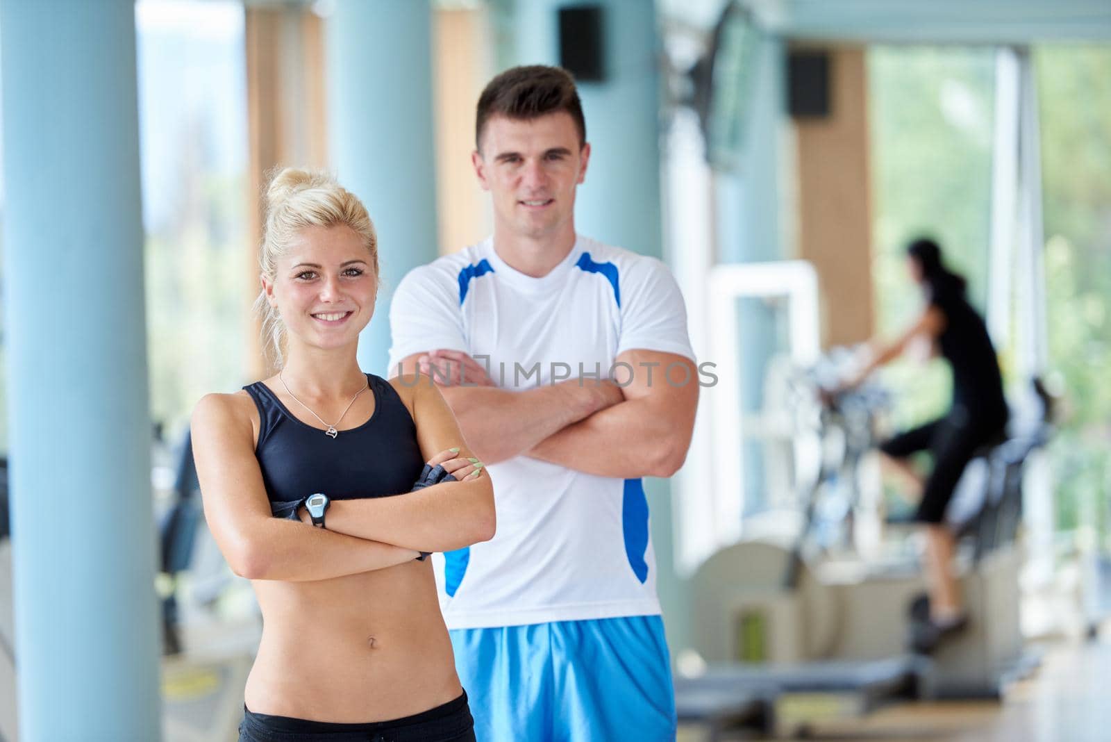 group portrait of healthy and fit young people in fitness gym