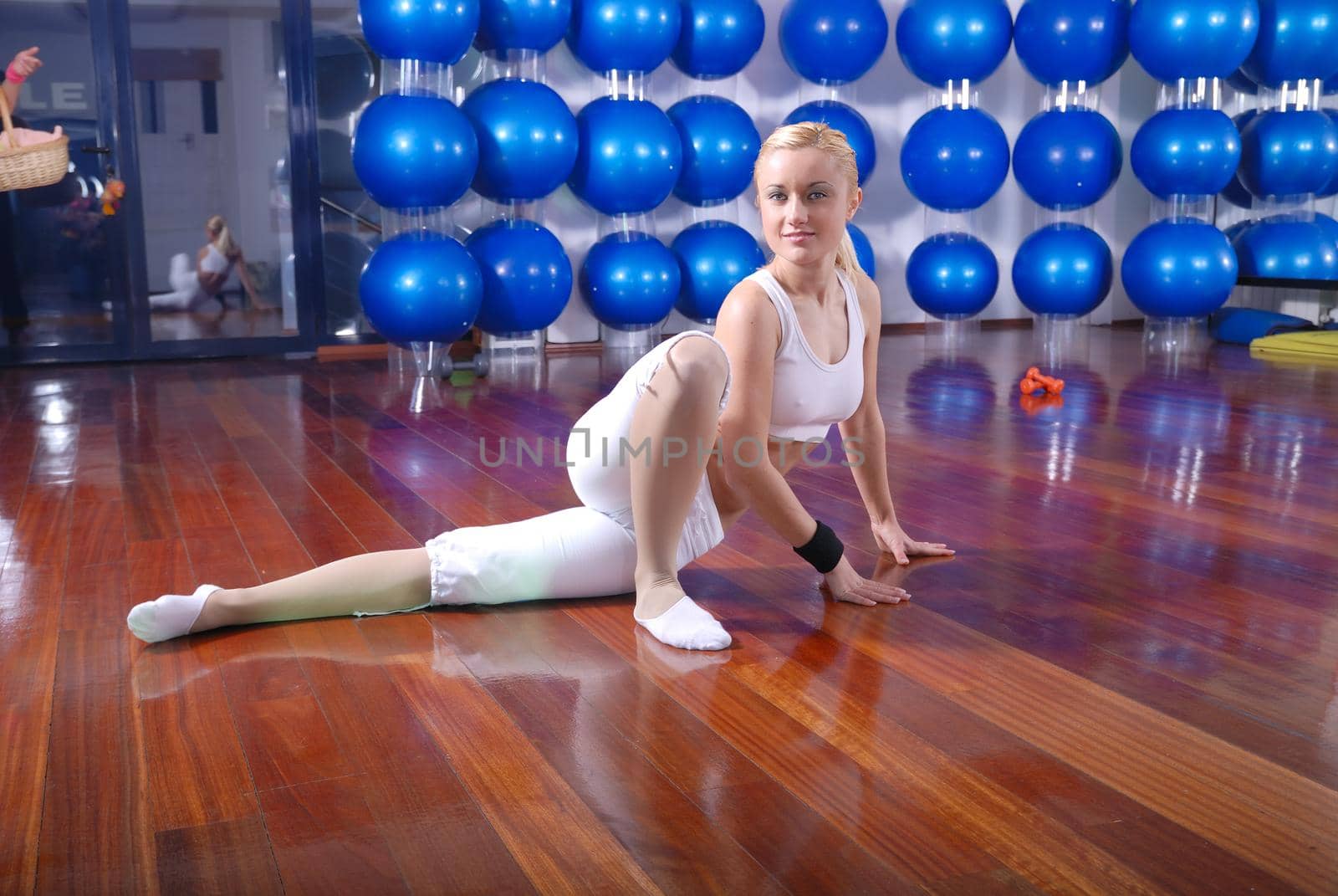 pretty blonde girl working out in fitness club