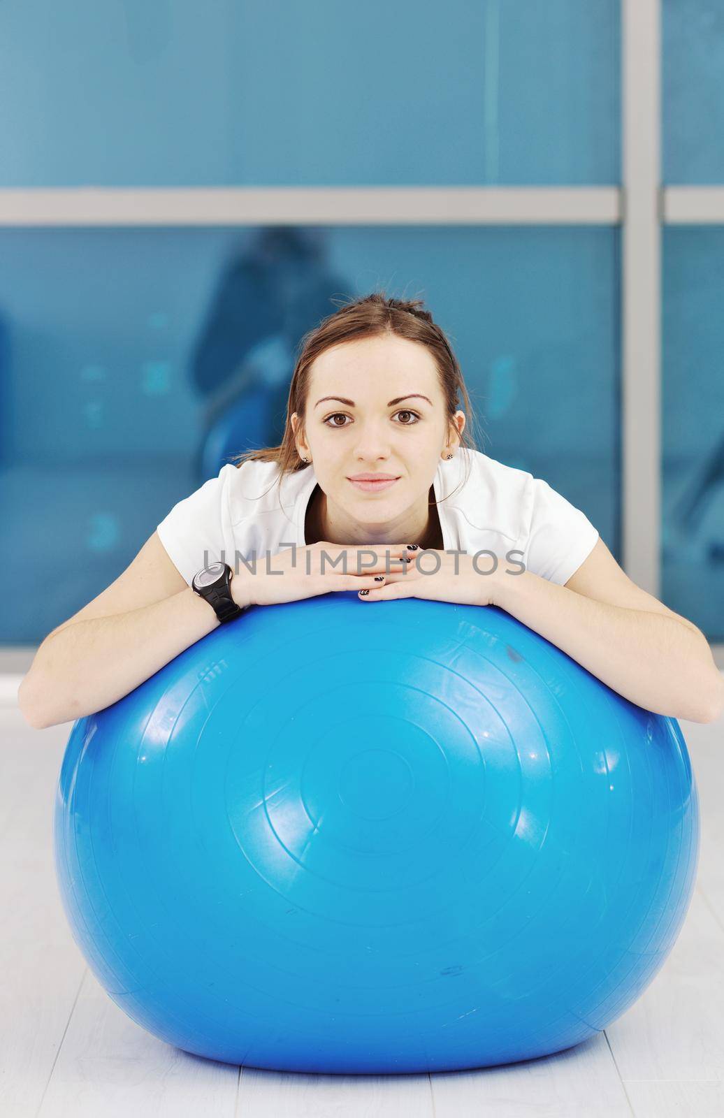 happy diet concept with young woman on pink scale at sport fitnes gym club