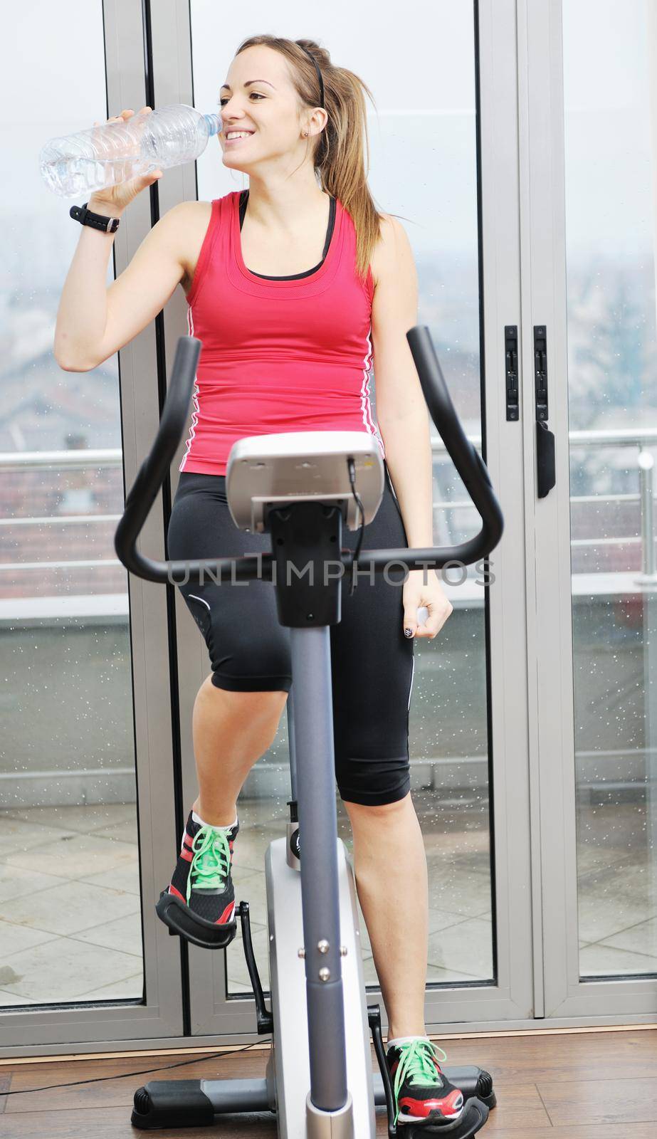 woman workout  in fitness club on running track  by dotshock