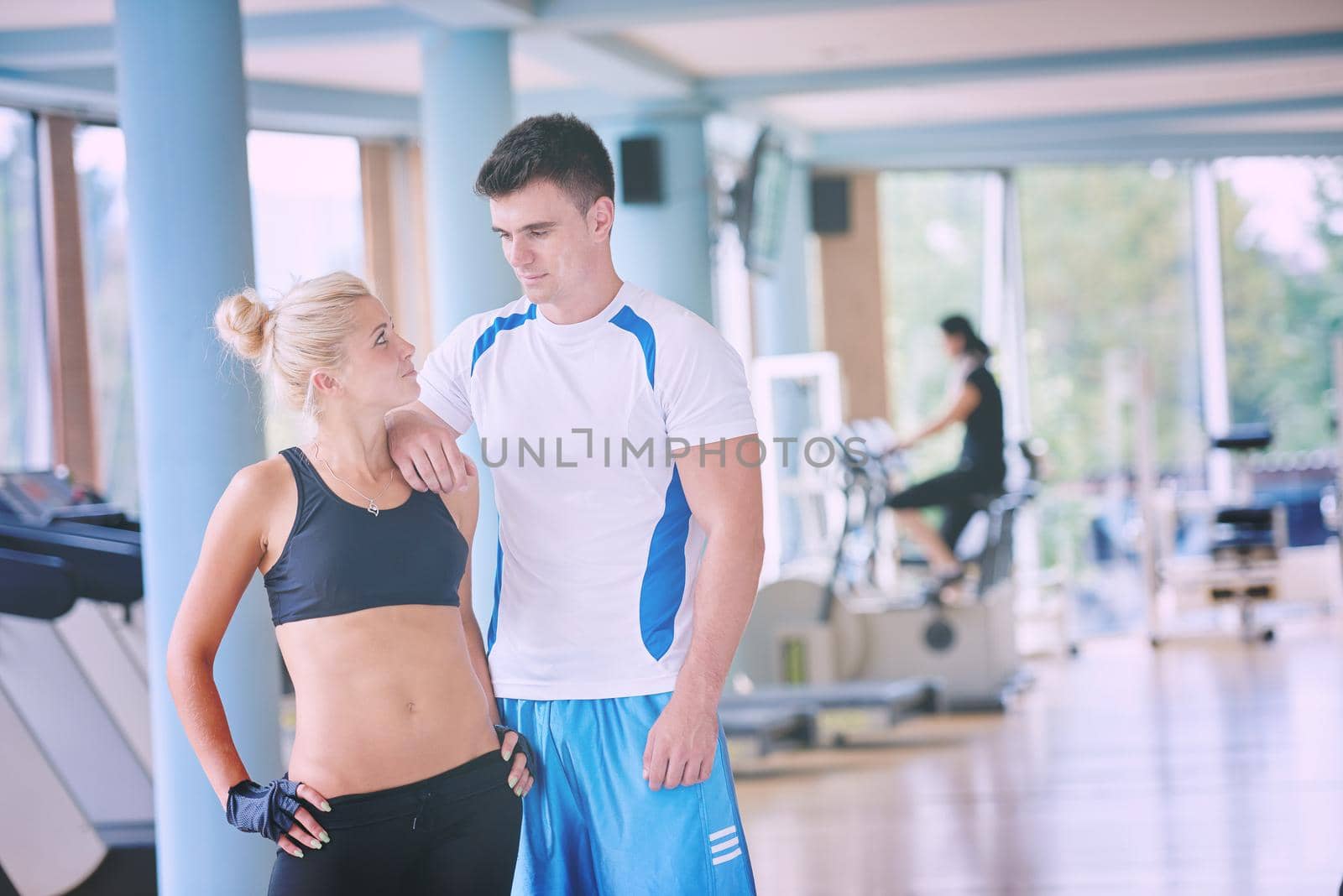 group portrait of healthy and fit young people in fitness gym