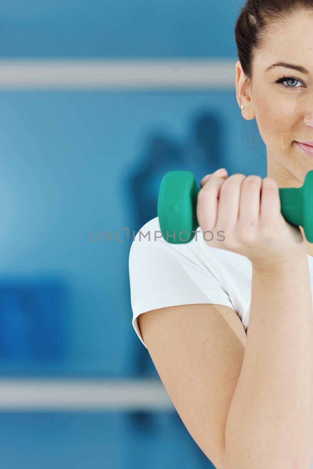 woman fitness workout with weights by dotshock