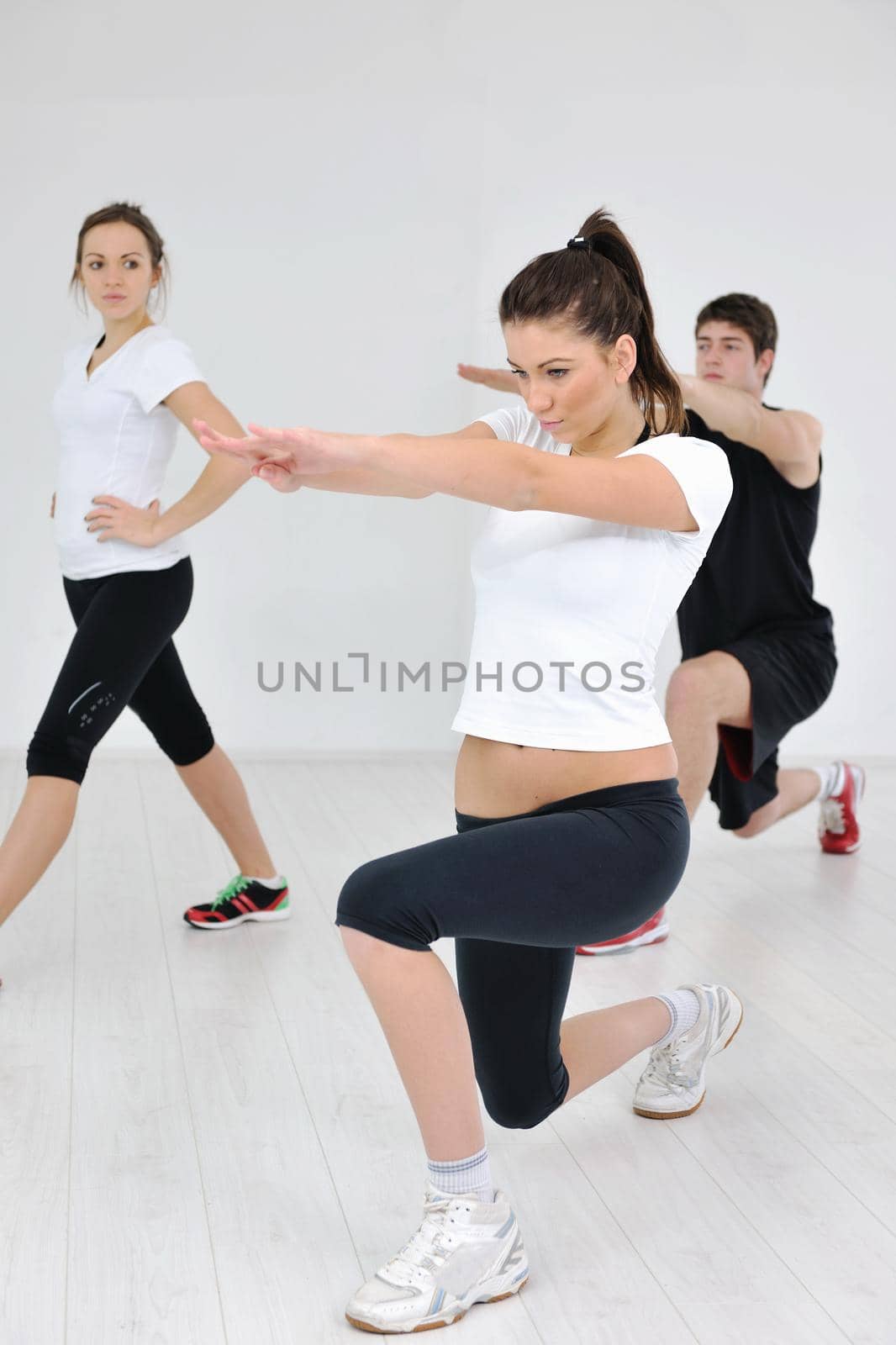 young people group in fitness club by dotshock