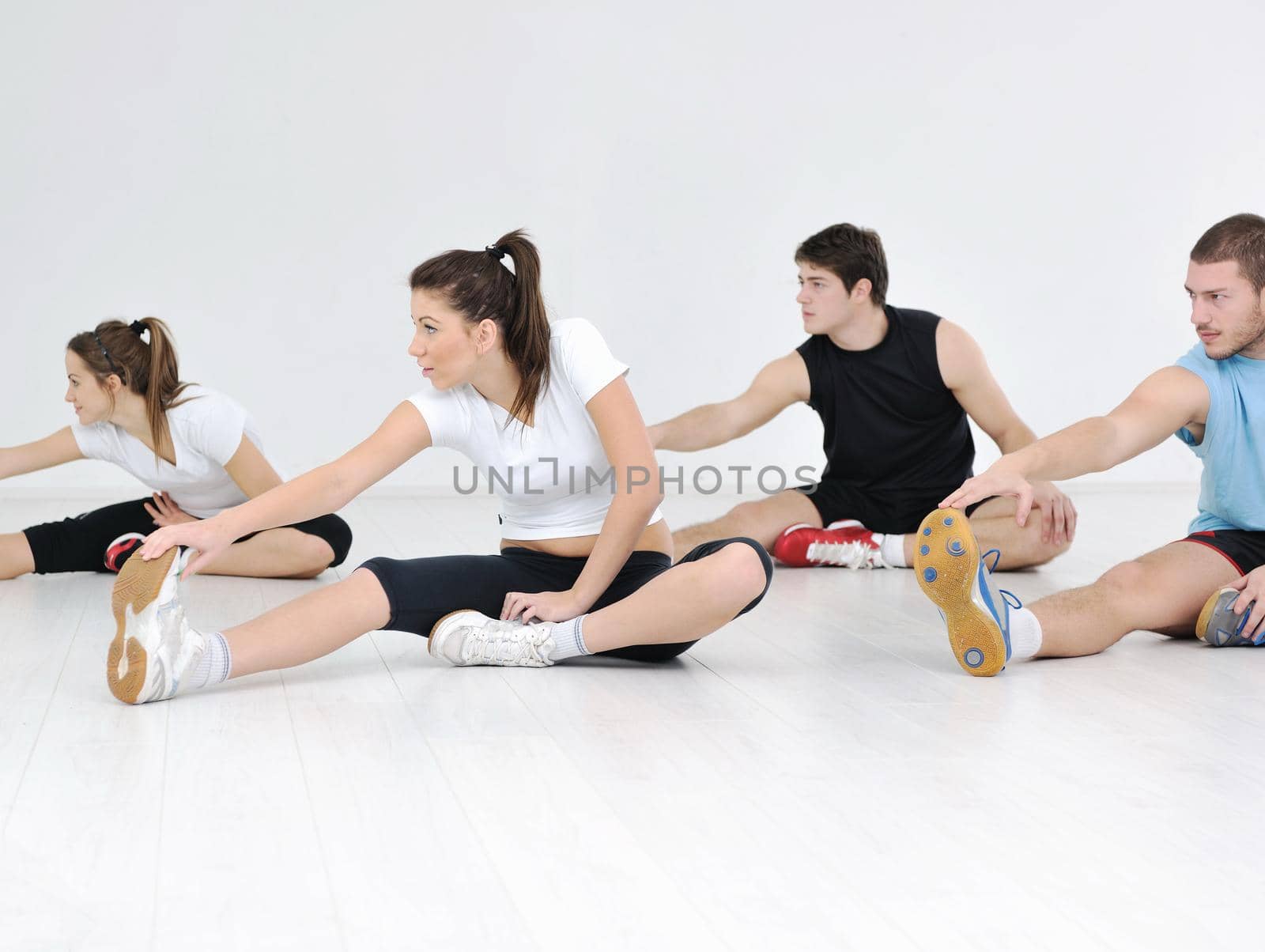 happy young people group in excercise and relax in  fitness club