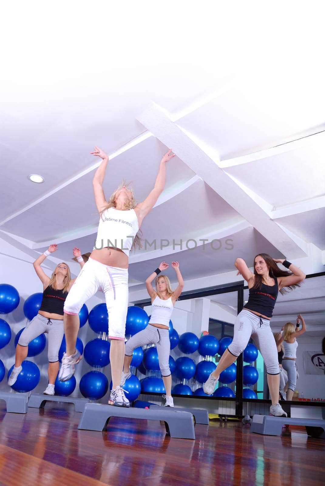 group of young girls stepping in fitness club