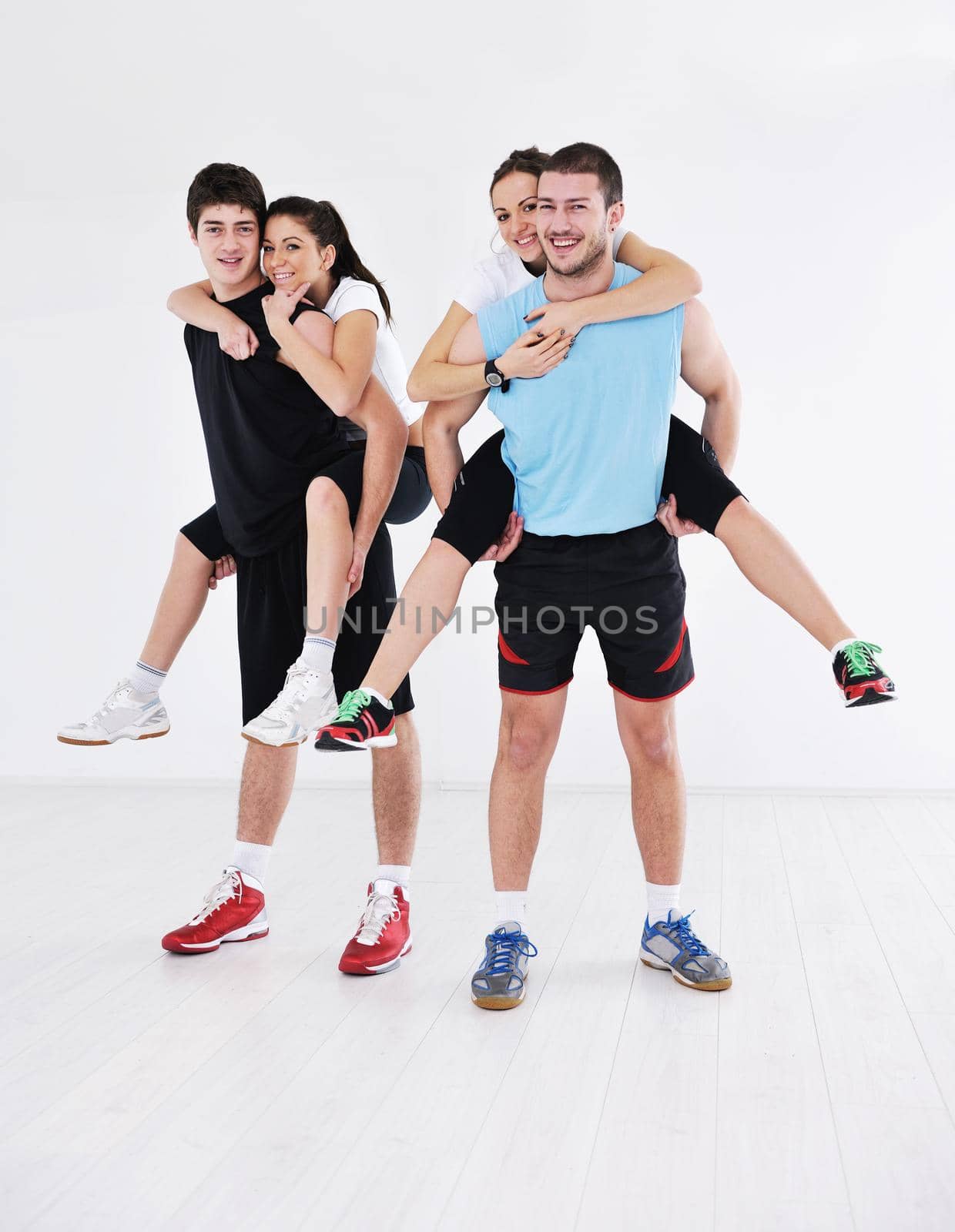 young people group in fitness club by dotshock