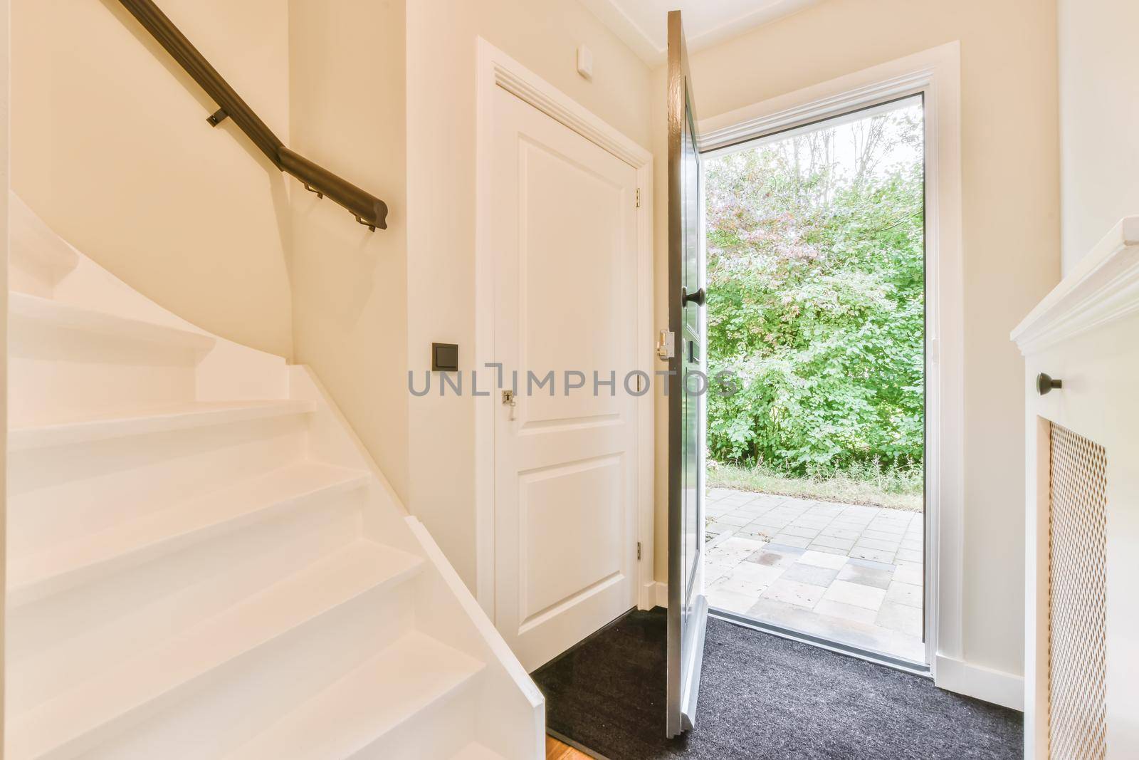 Open front door to the street in elegant house