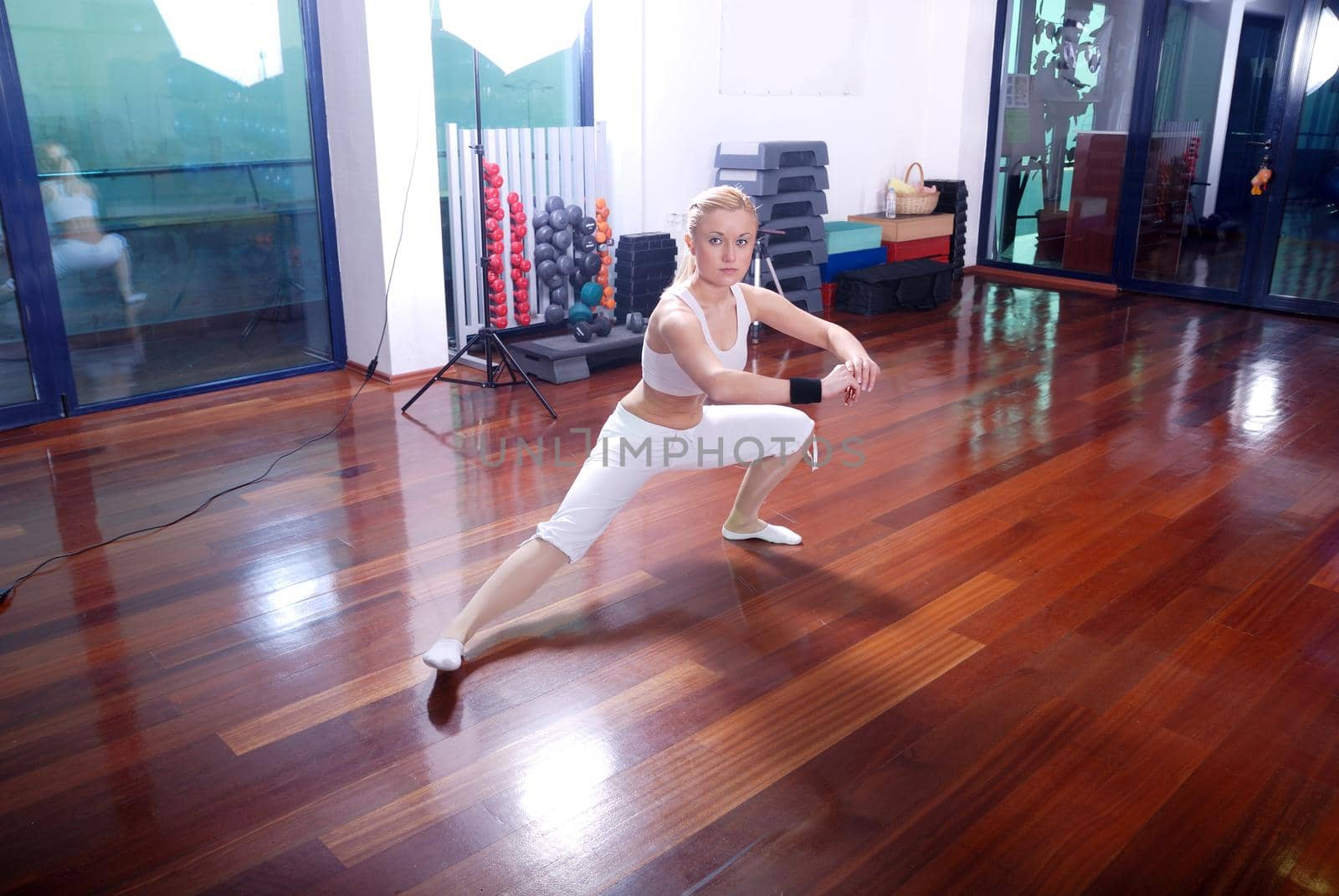 blonde girl exercising yoga  by dotshock