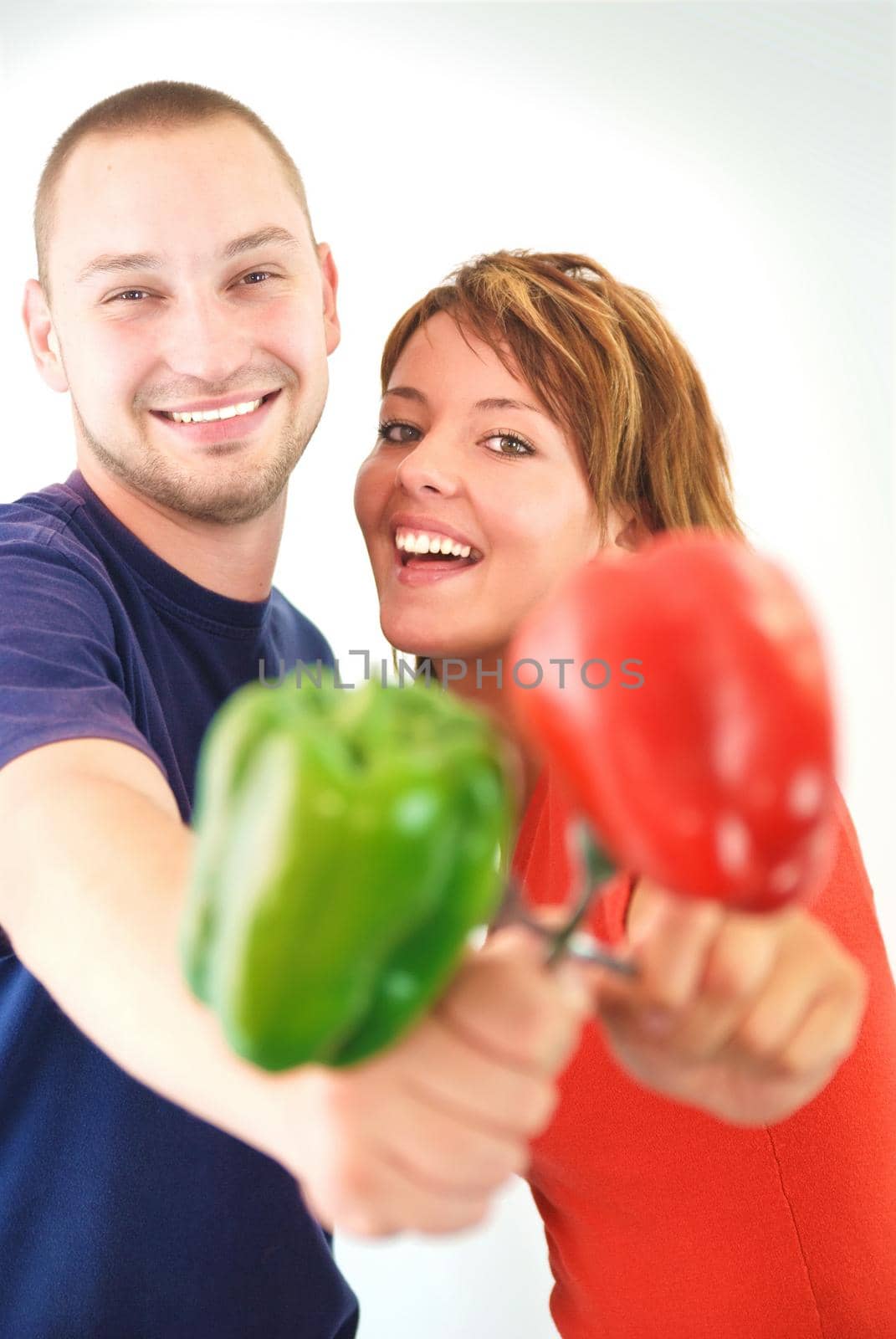 happy couple with pepper vegetable isolated