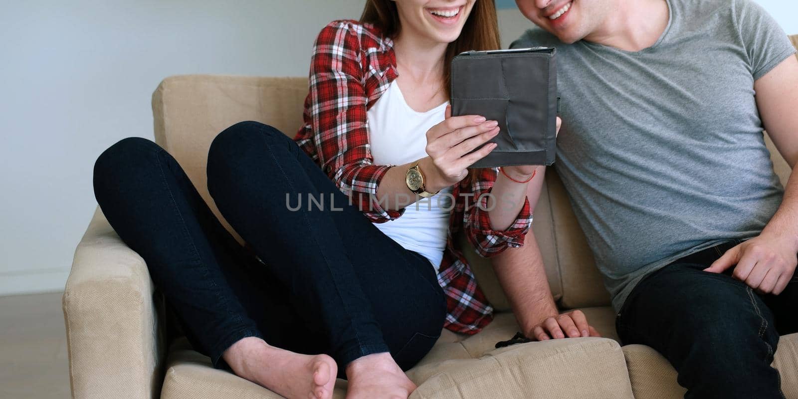 Young Couple using interent on digital tablet