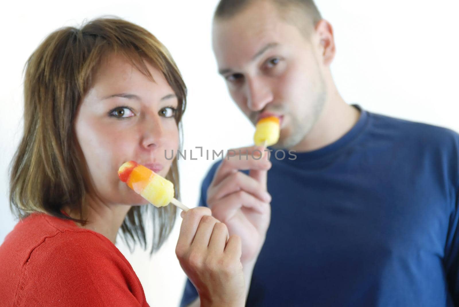 happy couple withe ice cream isolated on white background