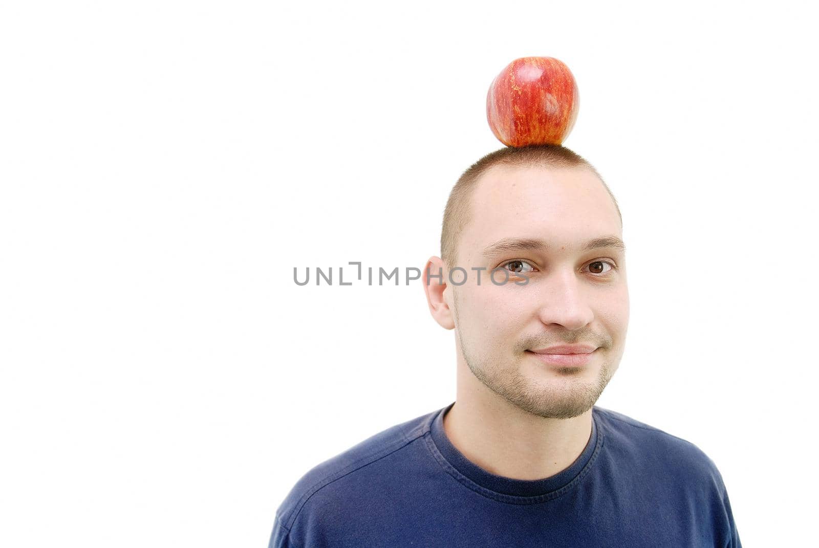 man with apple on head