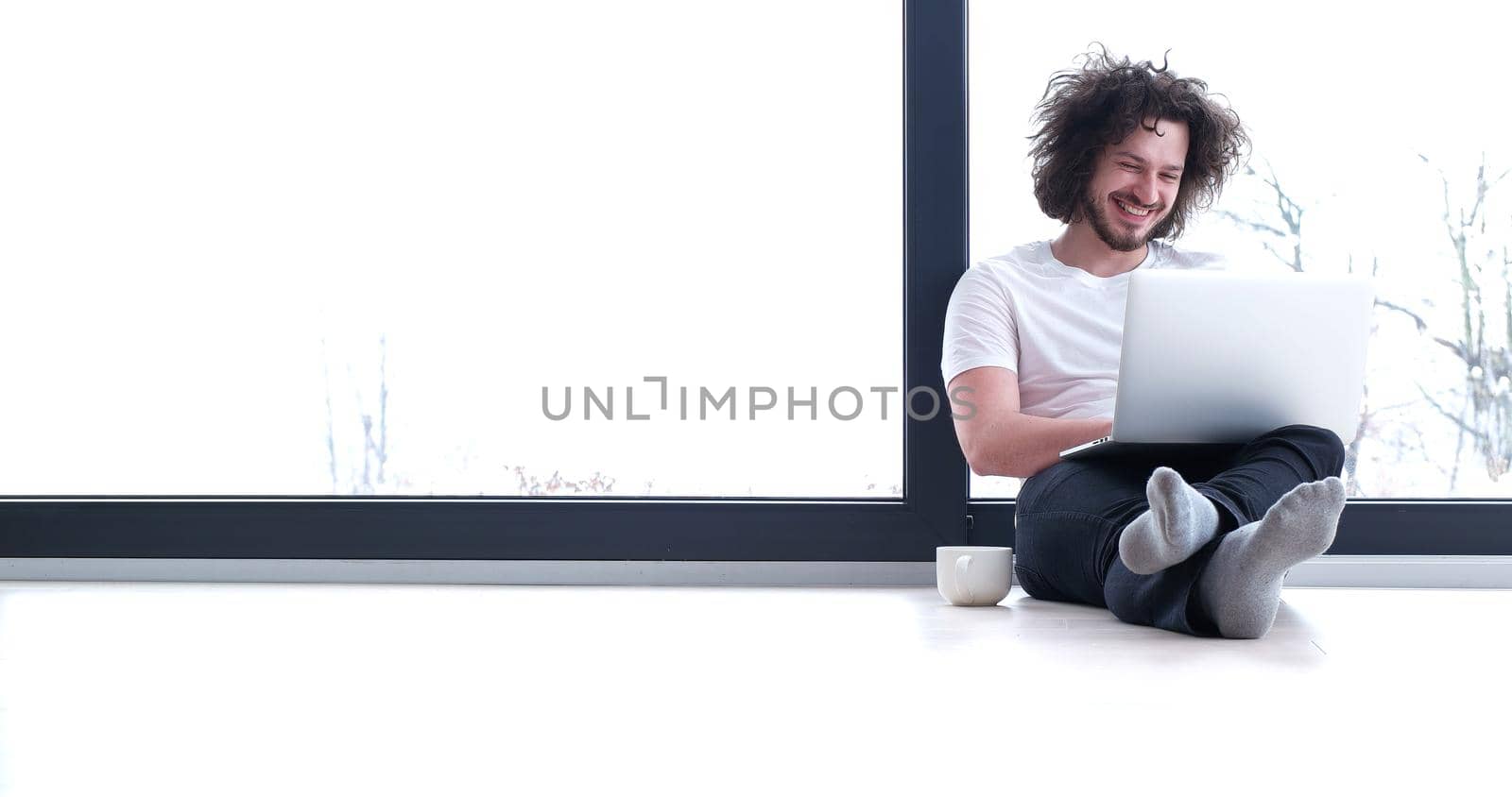 Real man Using laptop on the floor At Home  Enjoying Relaxing