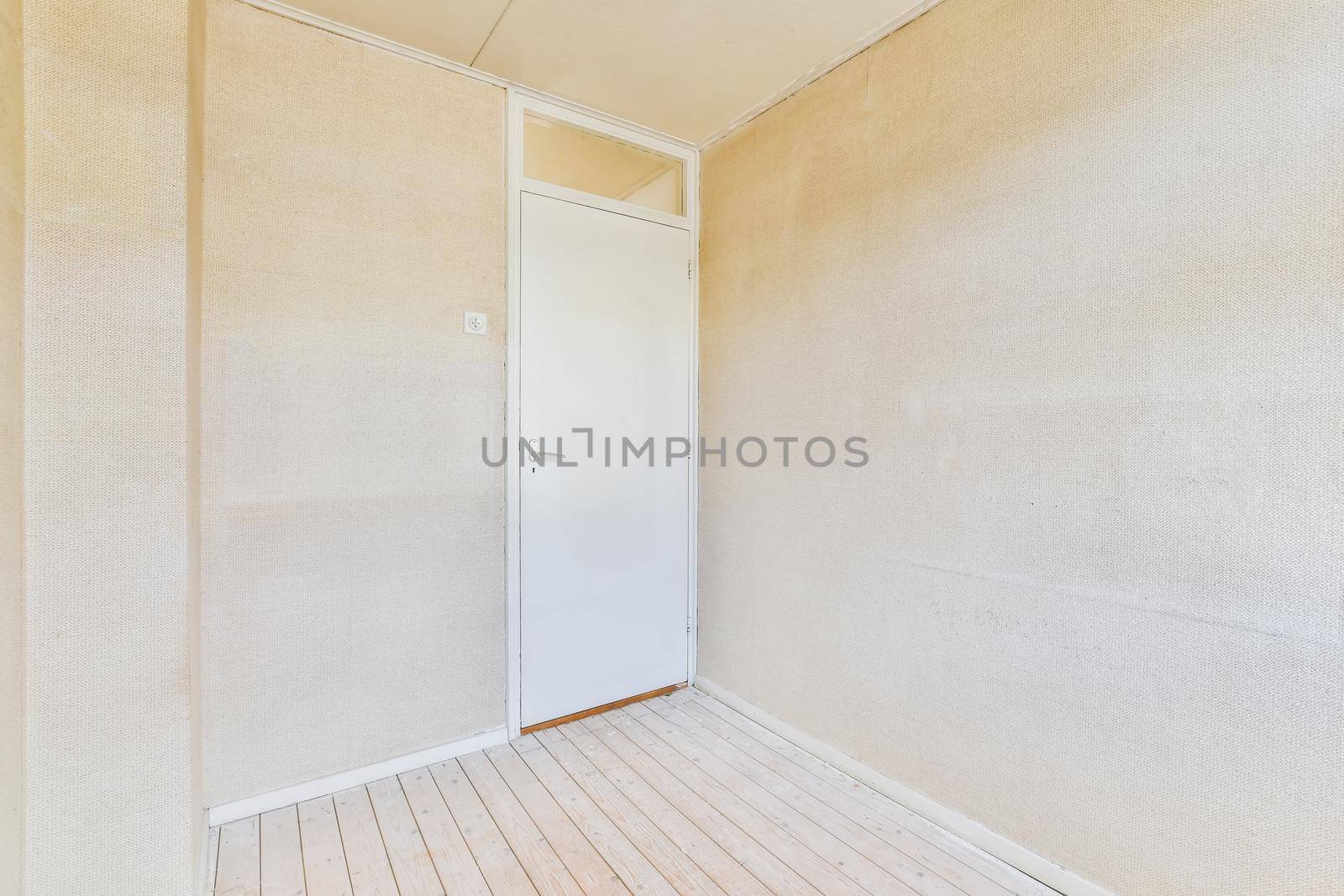 Empty room in daylight with wooden floor