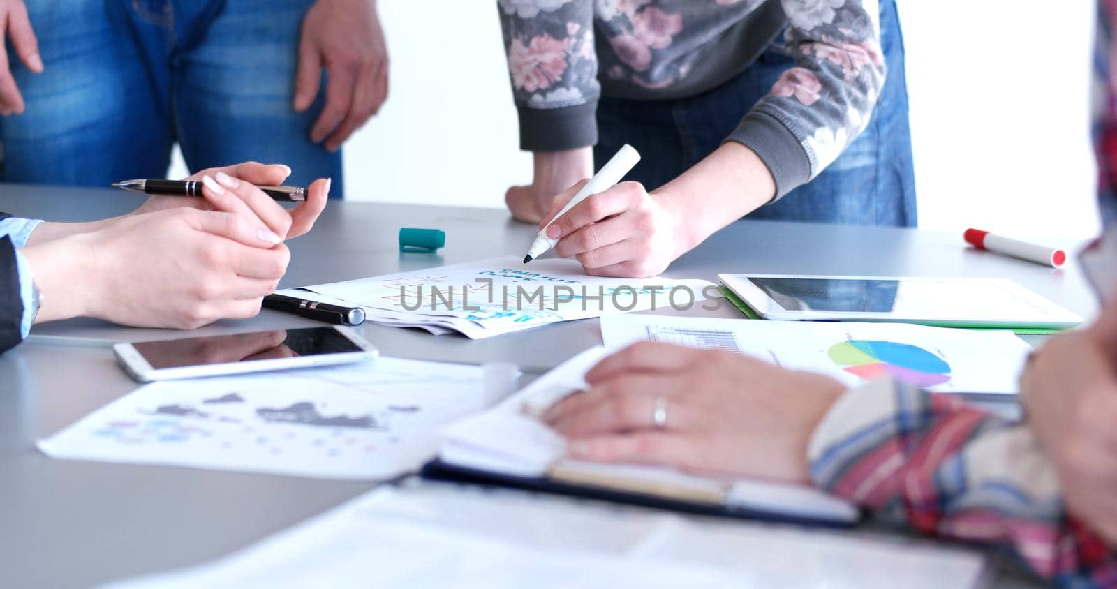 office and teamwork concept - group of business people having a meeting by dotshock