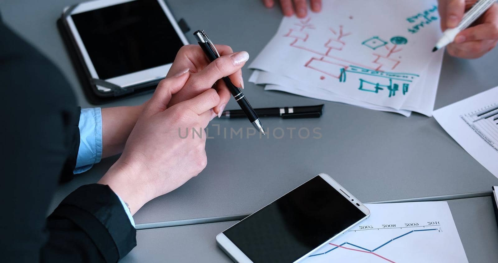 office and teamwork concept - group of business people having a meeting by dotshock