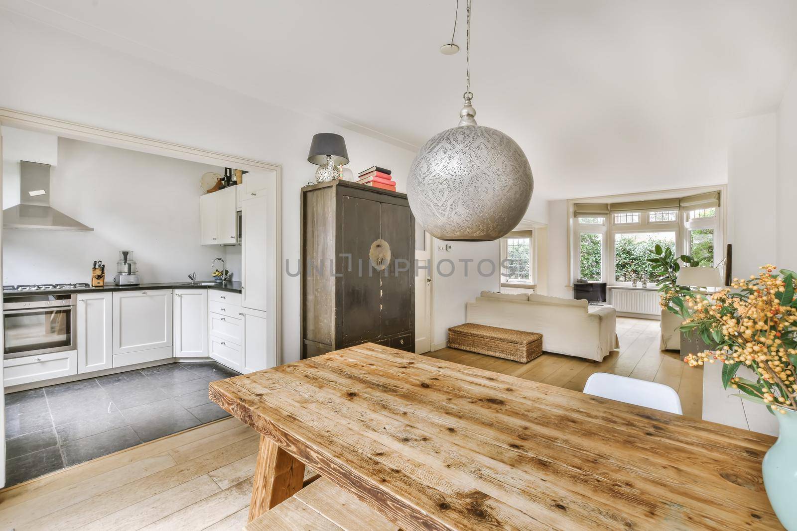 Interior design of modern dining room with stylish furniture