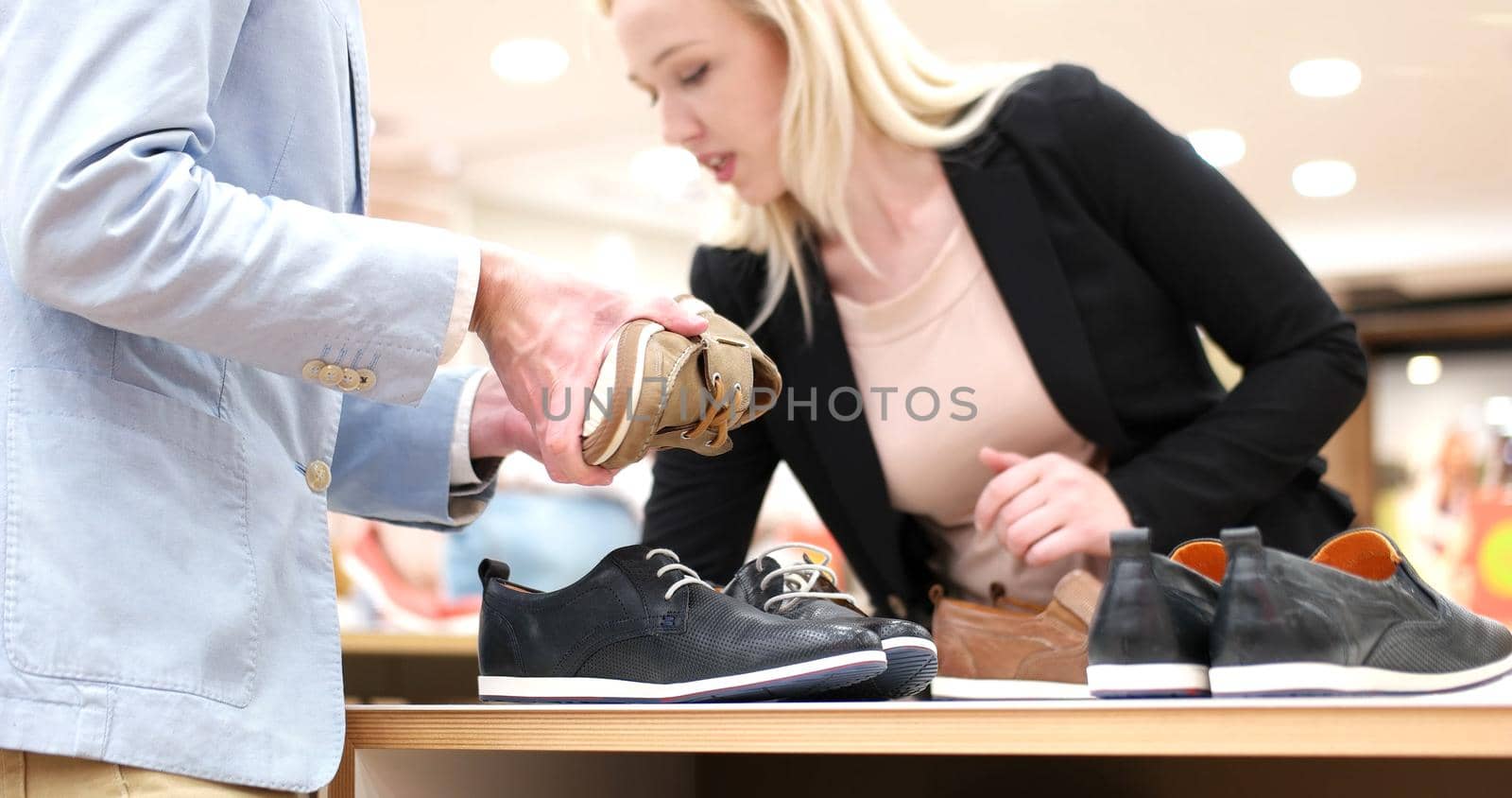Man Chooses Shoes At Shoe Store by dotshock