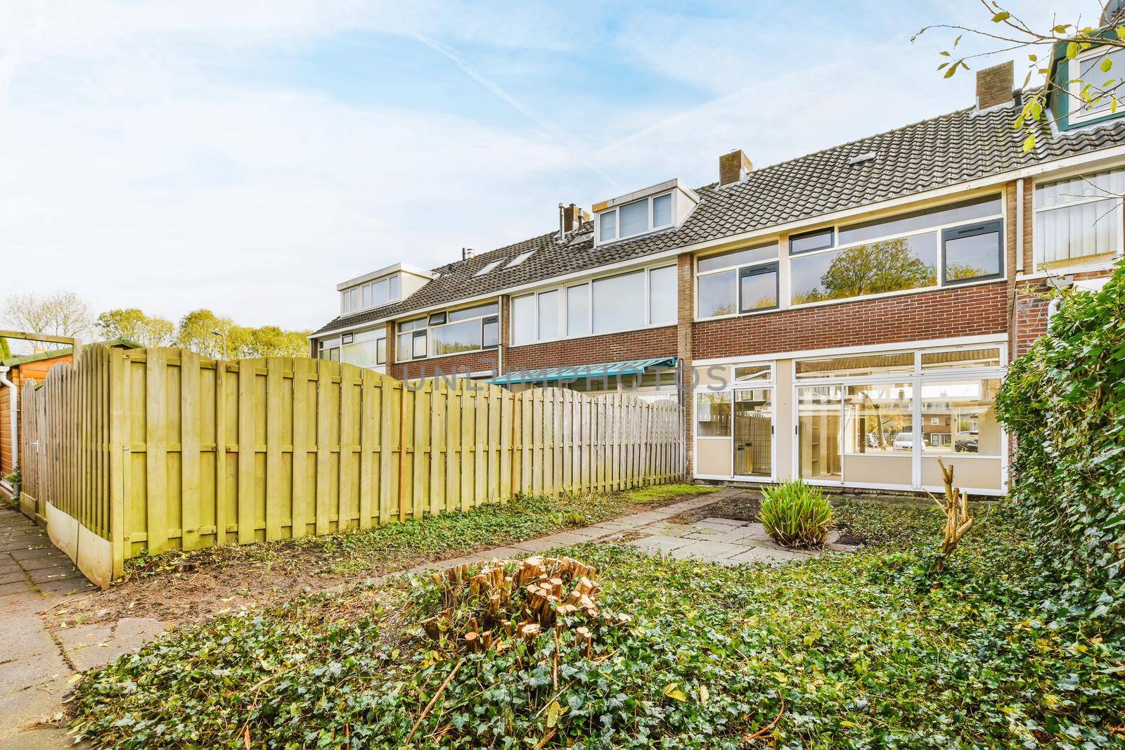 Delightful courtyard of a lovely home with a fence