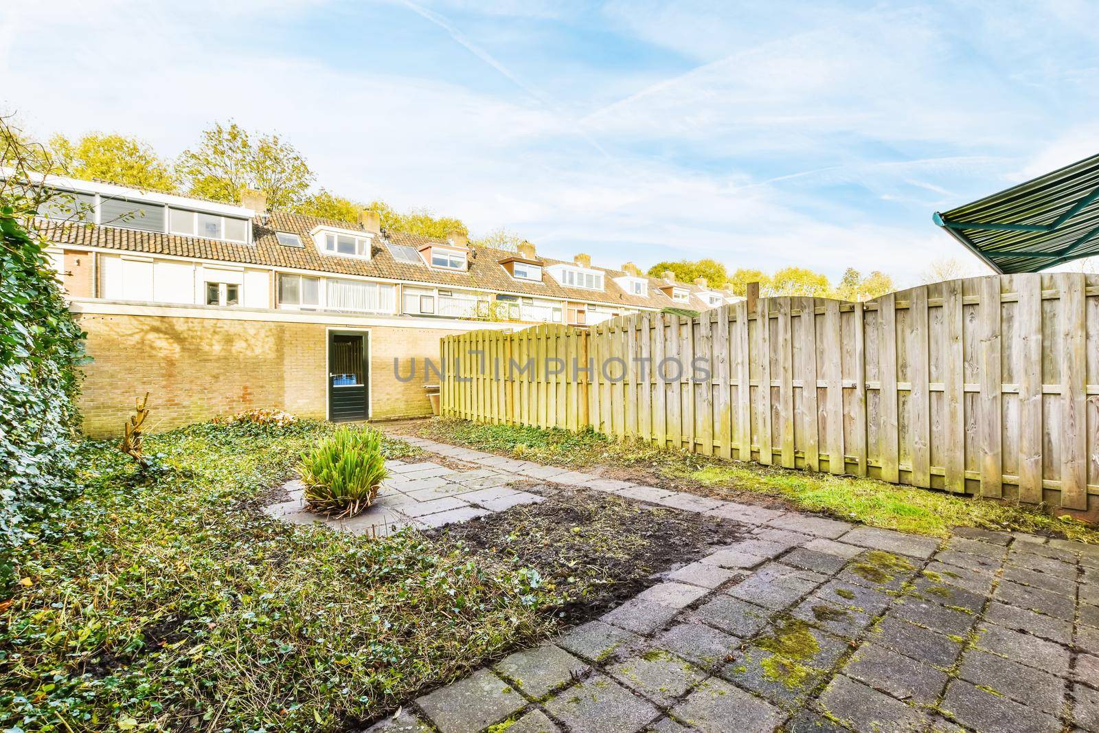 Delightful courtyard of a lovely home with a fence