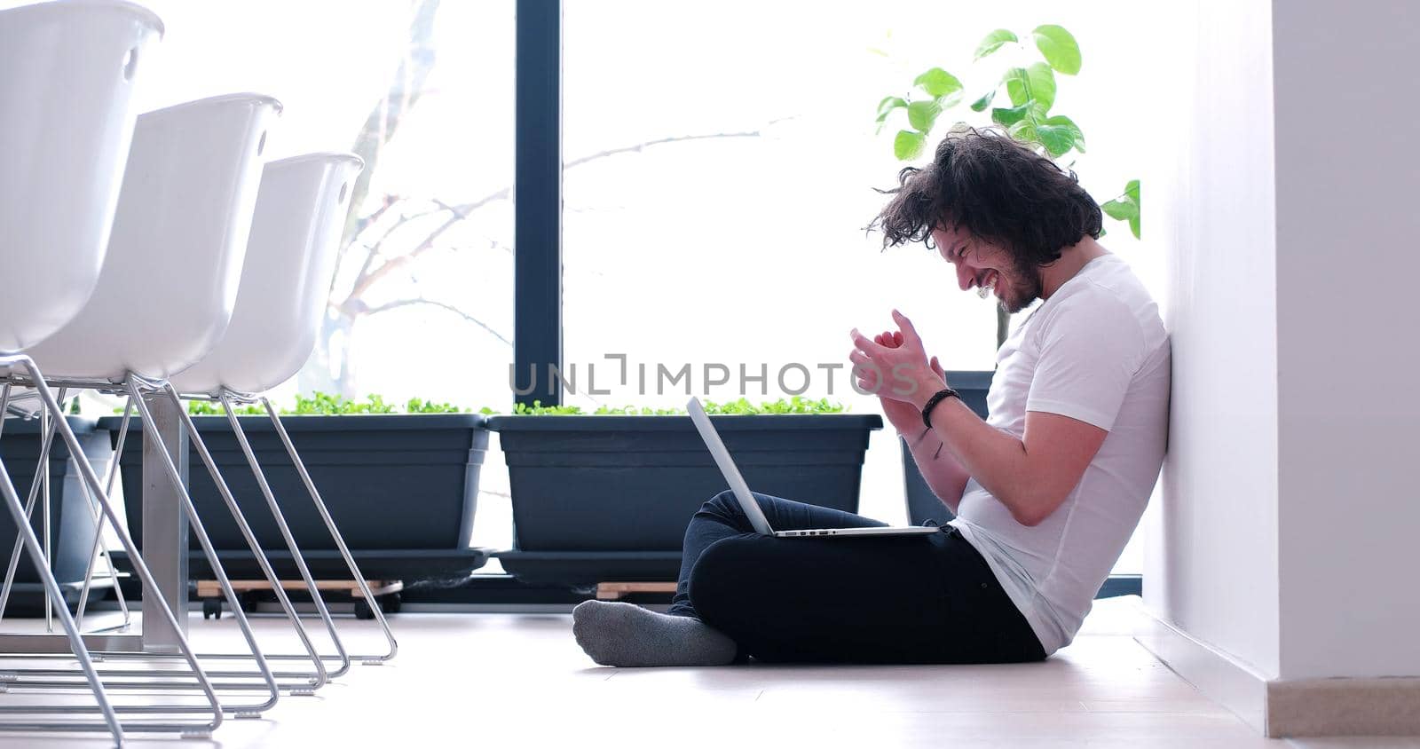 Real man Using laptop on the floor At Home  Enjoying Relaxing