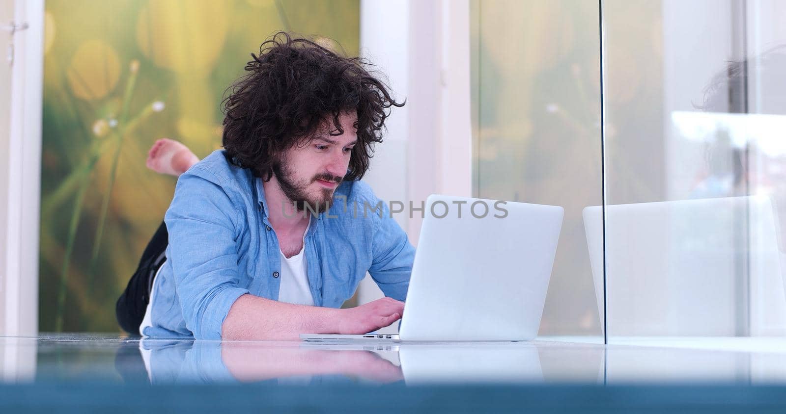 Real man Using laptop on the floor At Home  Enjoying Relaxing