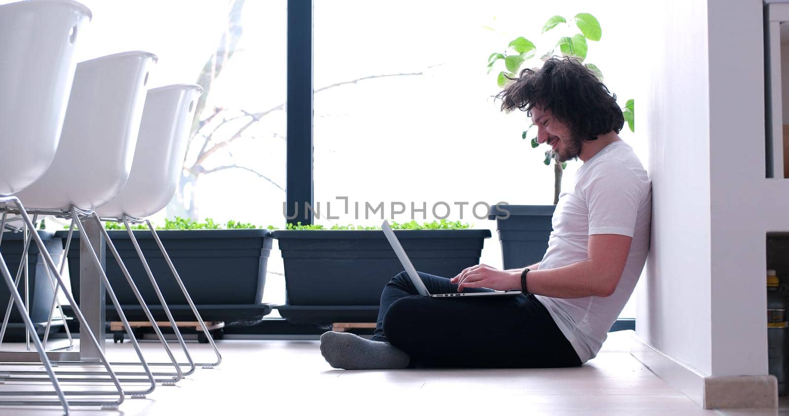 Real man Using laptop on the floor At Home  Enjoying Relaxing