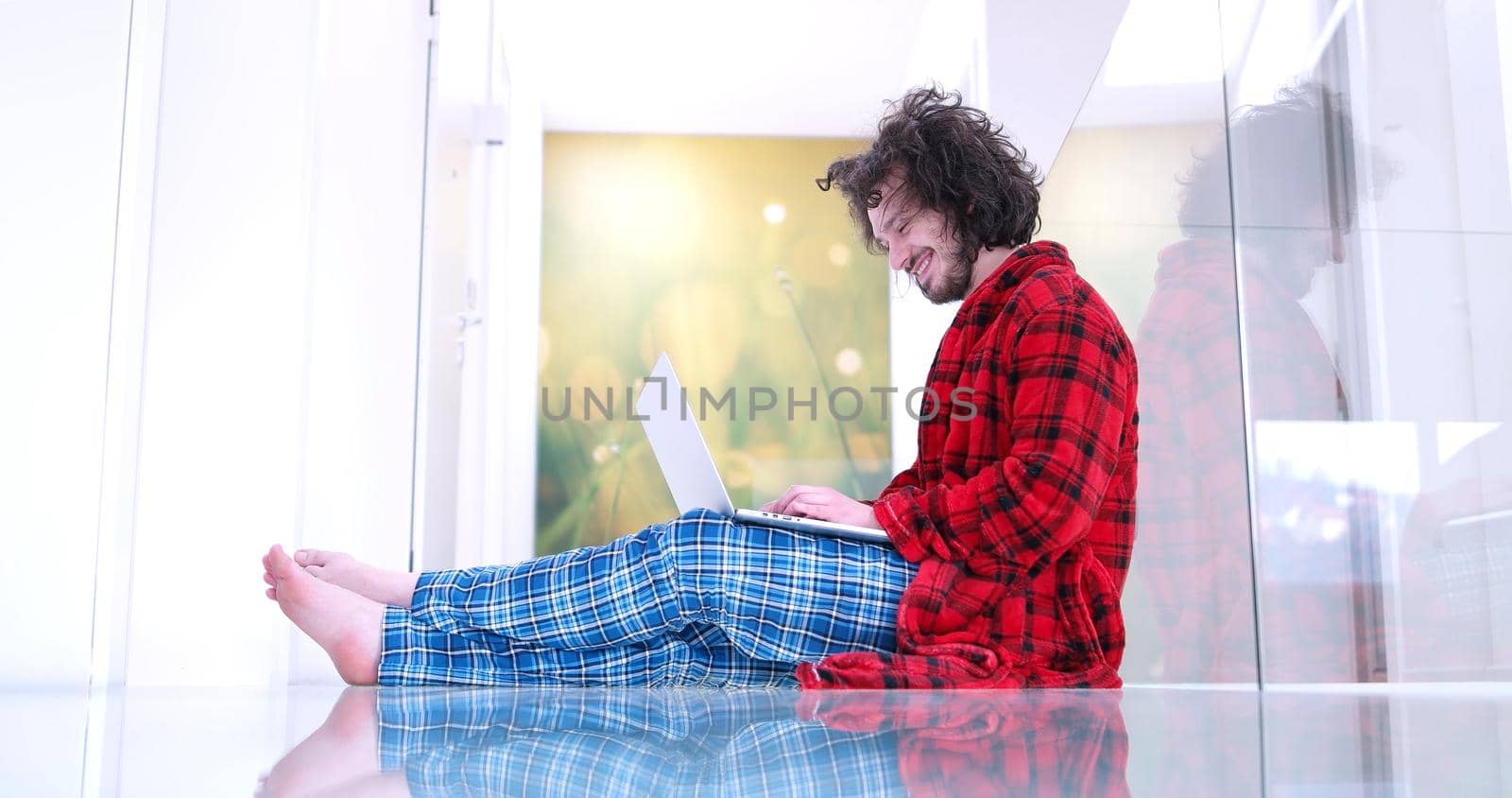 Real man Using laptop on the floor At Home  Enjoying Relaxing