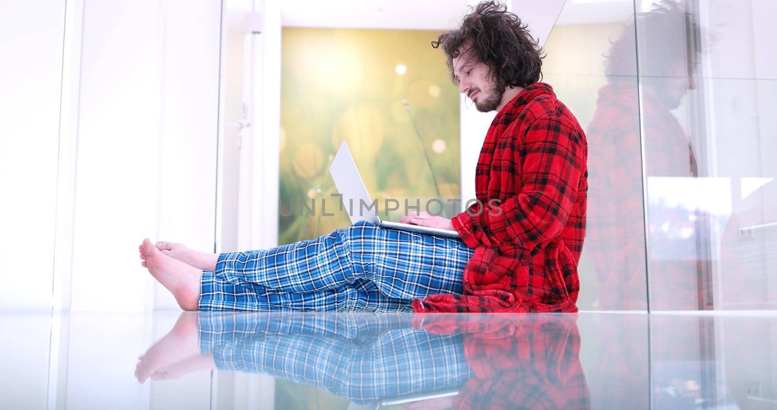 Real man Using laptop on the floor At Home  Enjoying Relaxing