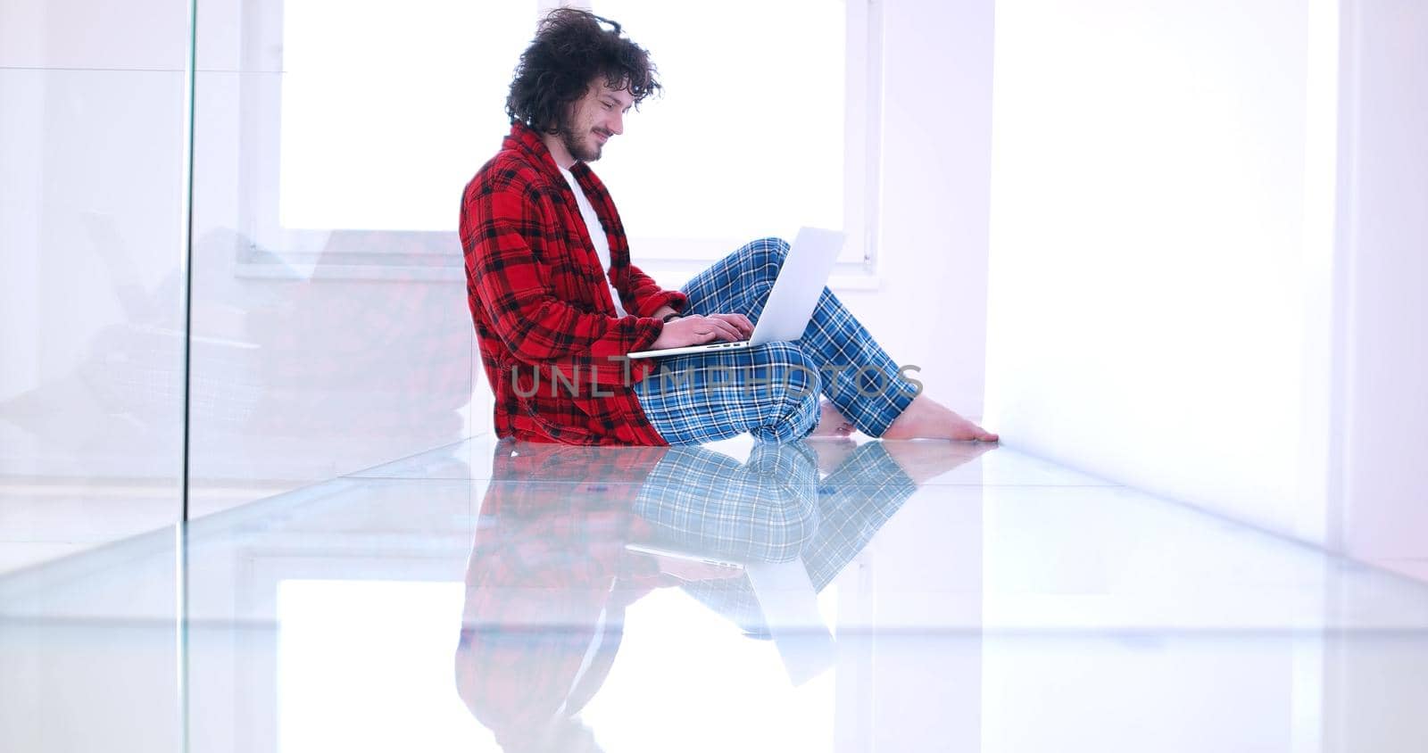 Real man Using laptop on the floor At Home  Enjoying Relaxing