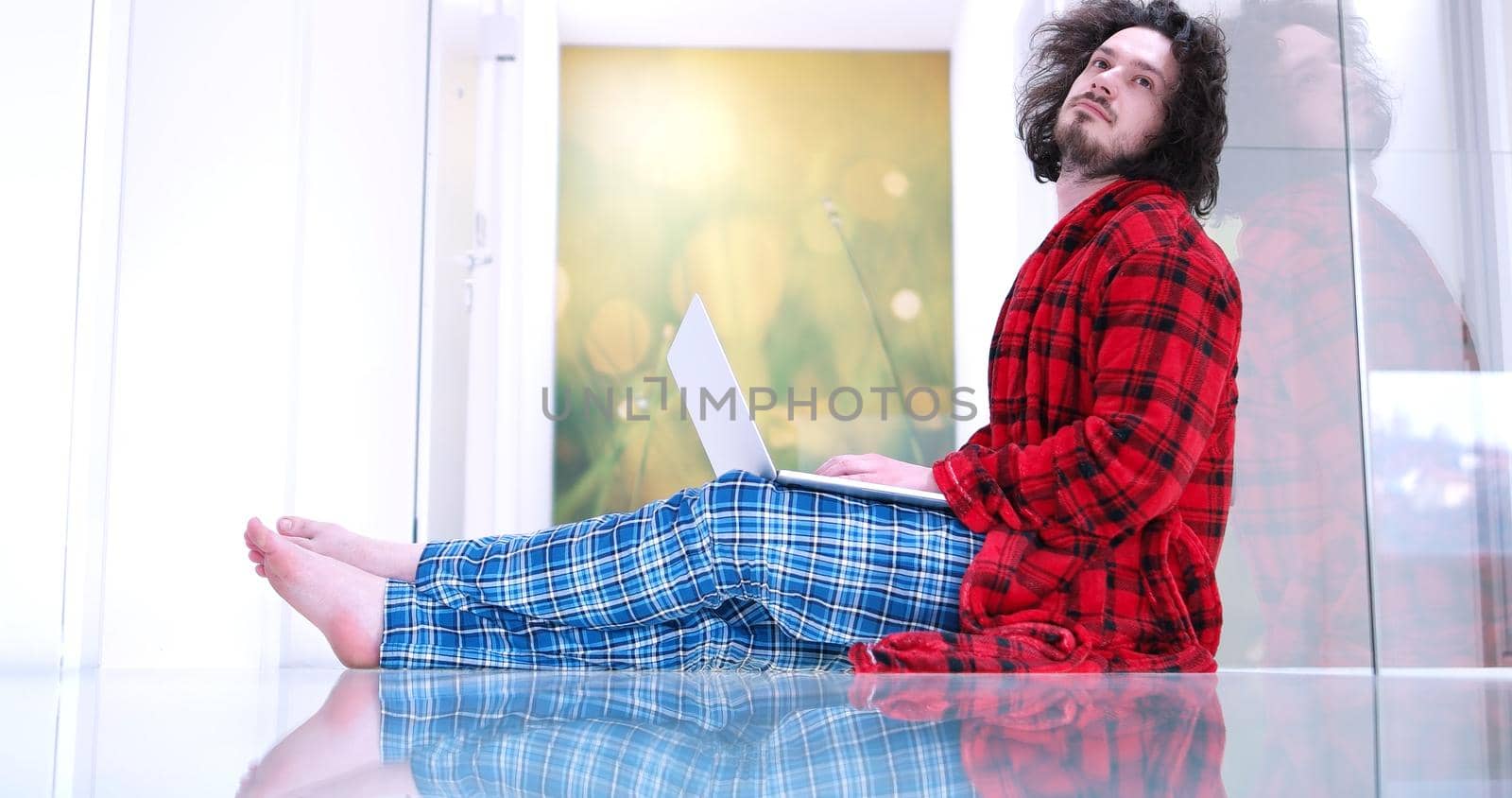 Real man Using laptop on the floor At Home  Enjoying Relaxing