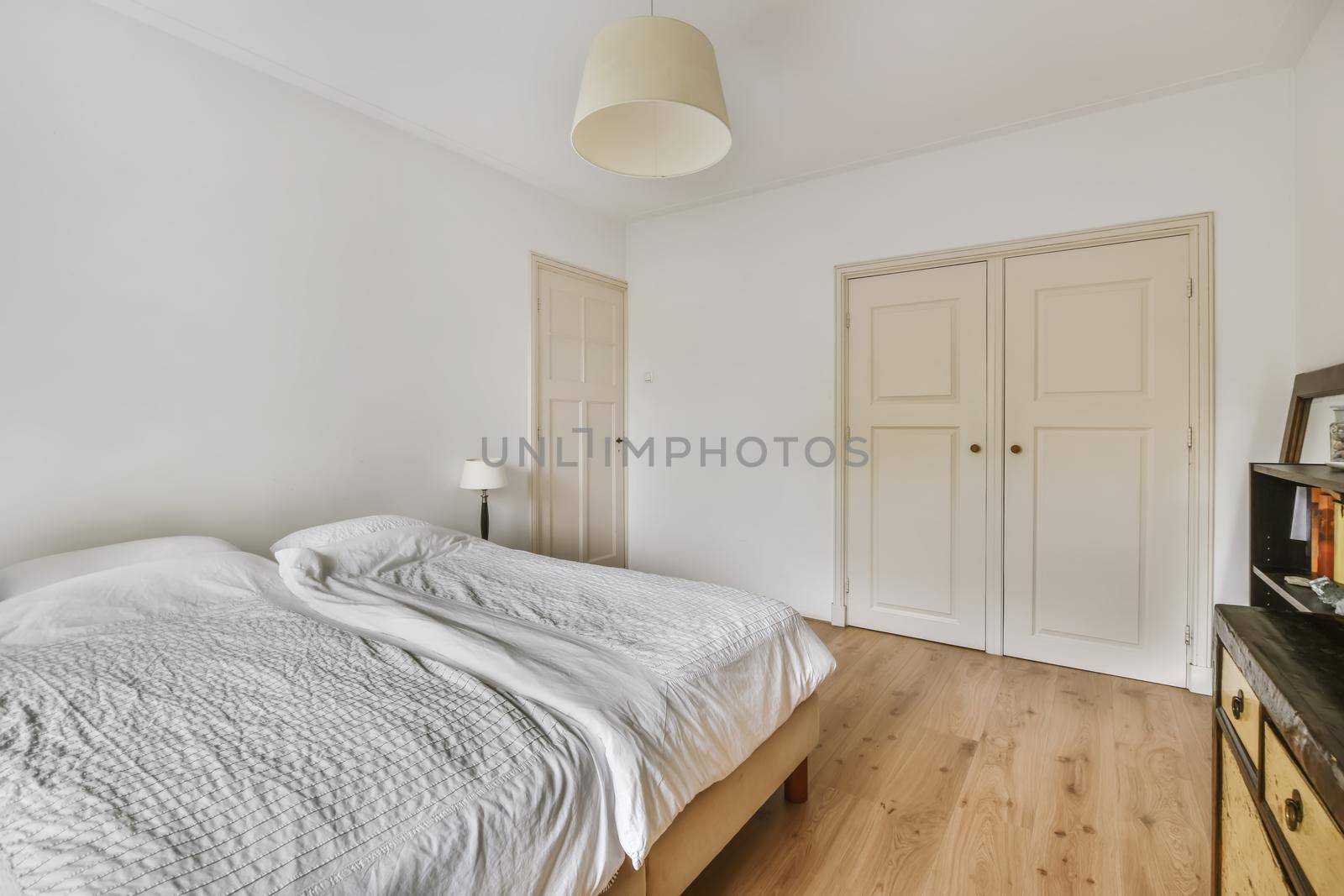 Beautiful bedroom in new luxury home with large bed