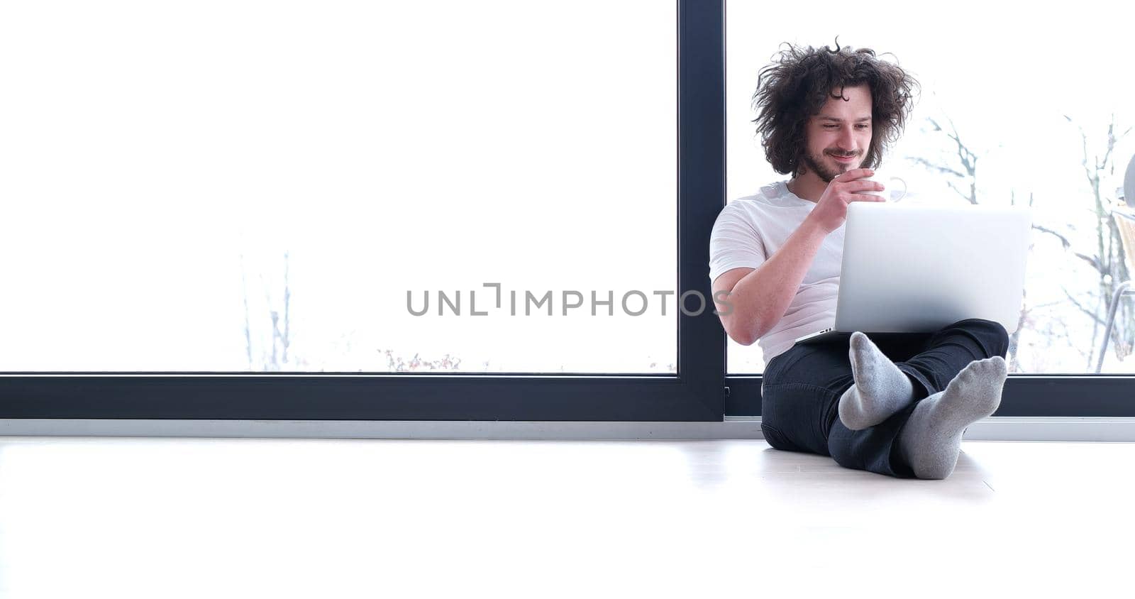 Real man Using laptop on the floor At Home  Enjoying Relaxing