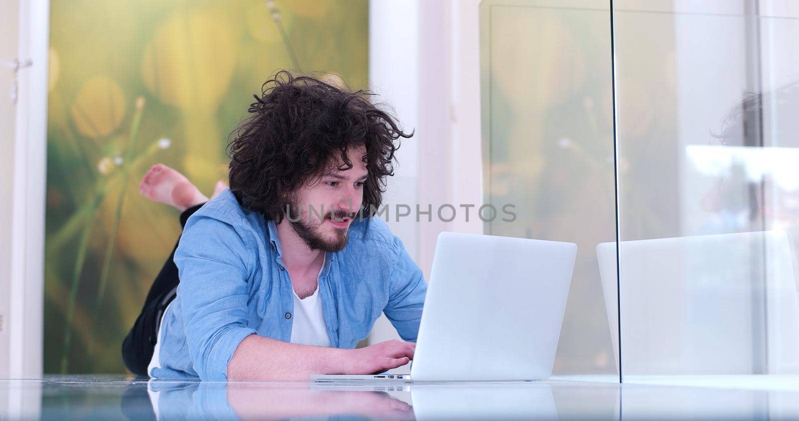 Real man Using laptop on the floor At Home  Enjoying Relaxing