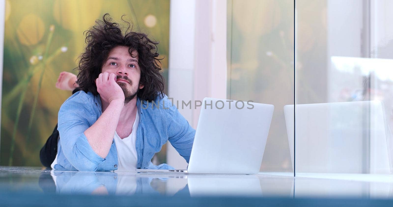 Real man Using laptop on the floor At Home  Enjoying Relaxing