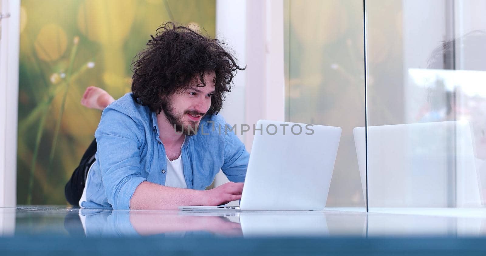 Real man Using laptop on the floor At Home  Enjoying Relaxing