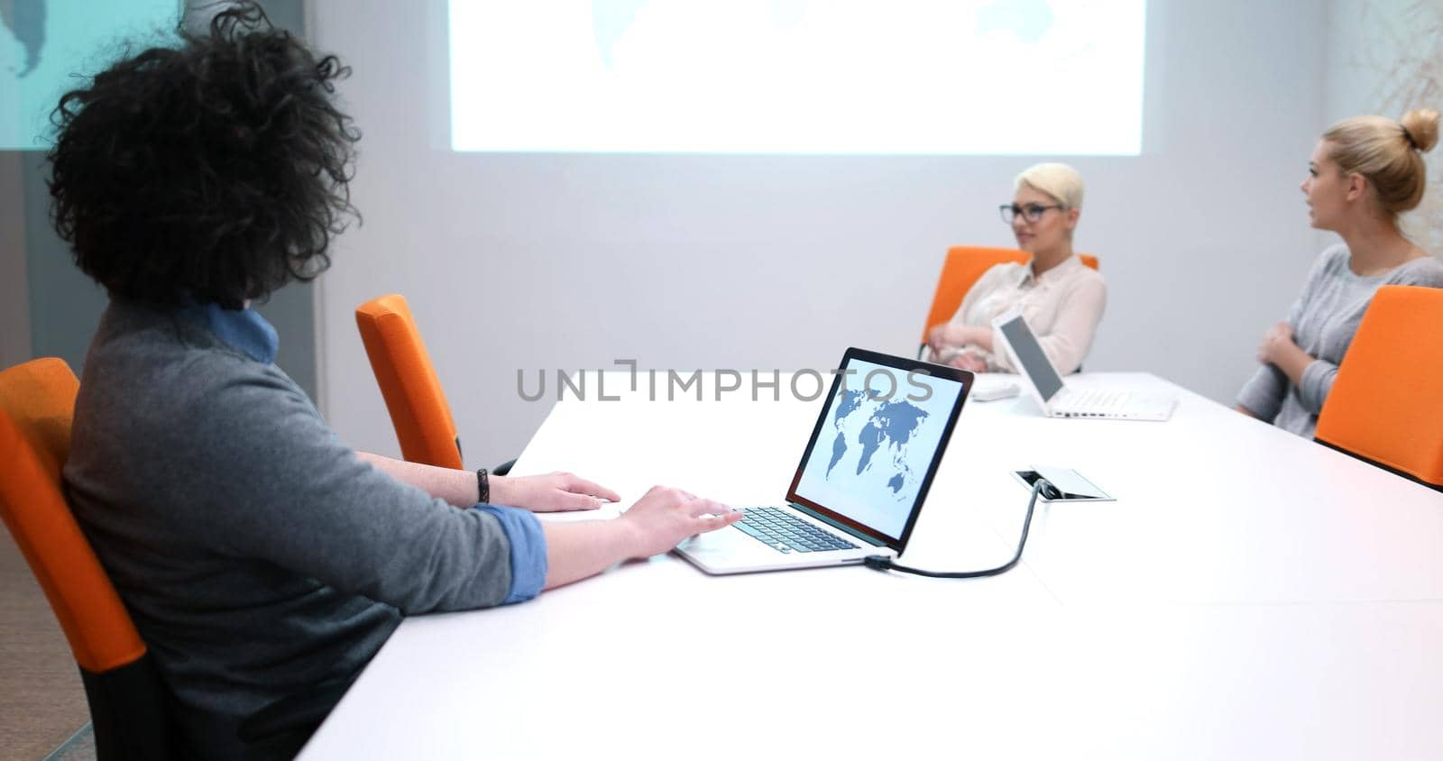 Group of a young business people discussing business plan at modern startup office building