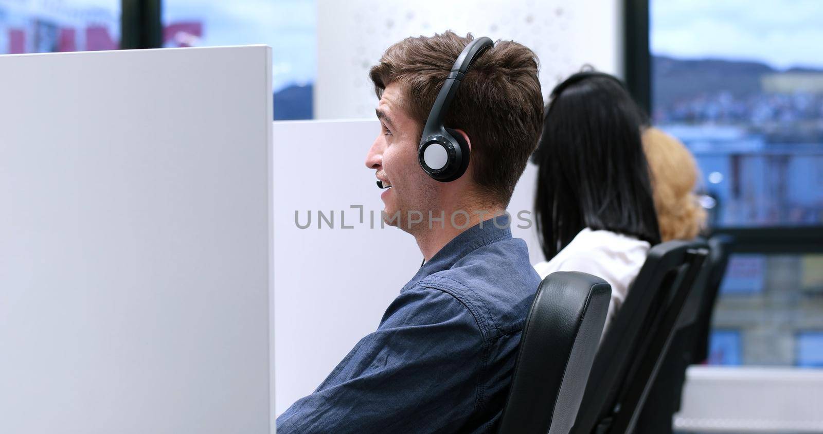 male call centre operator doing his job by dotshock