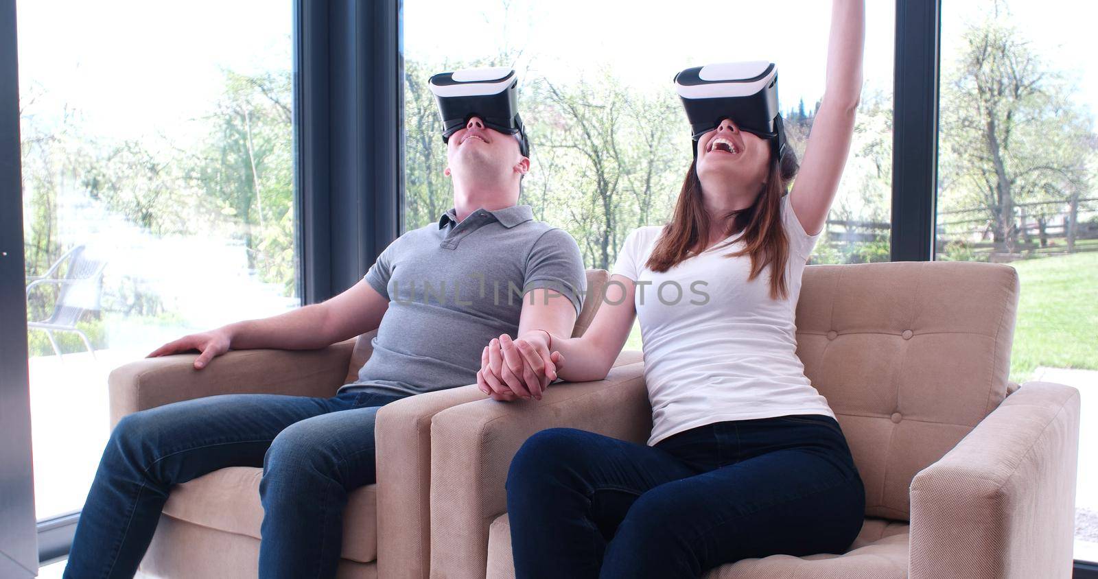 Couple using virtual reality headset by dotshock