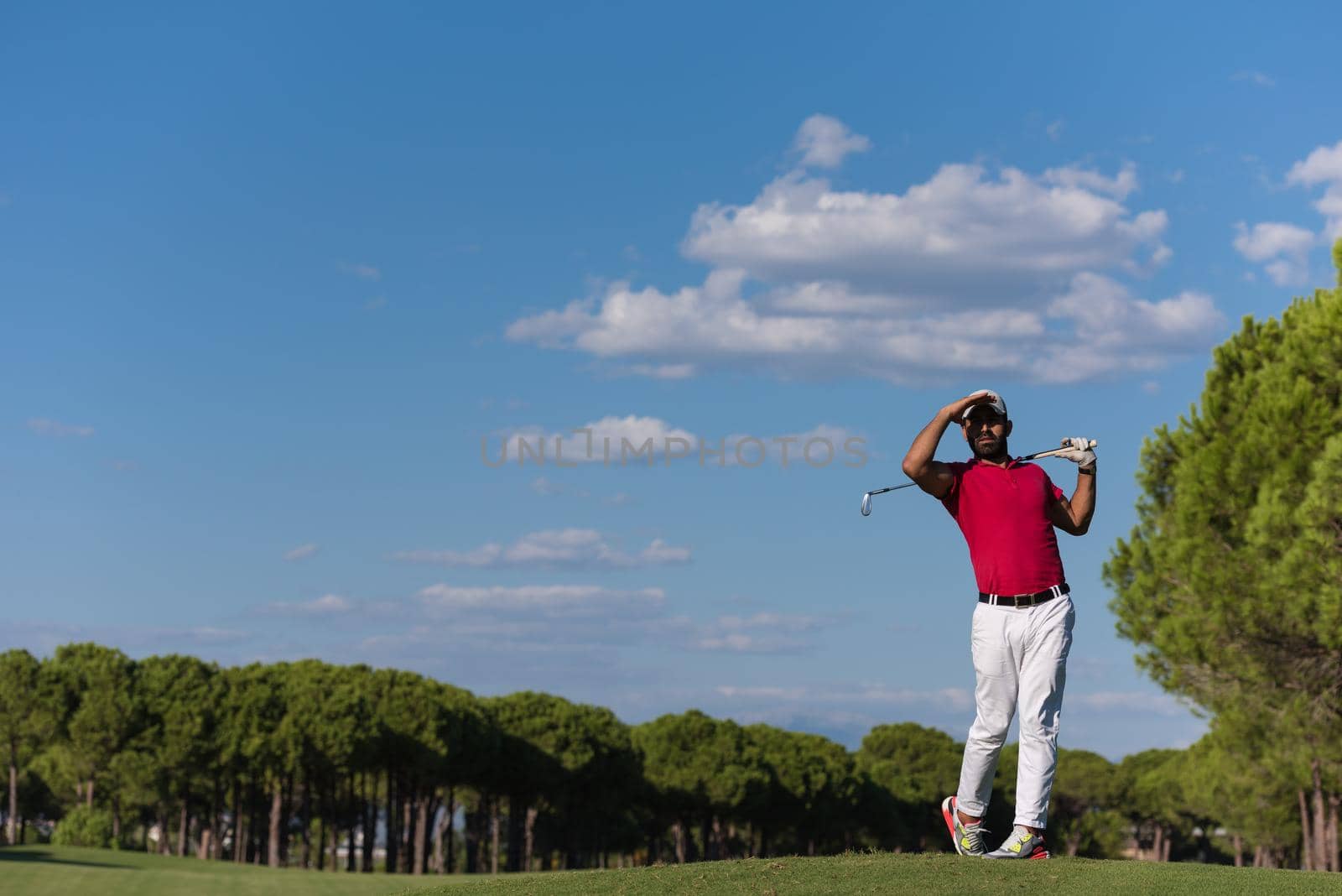 golf player hitting long shot by dotshock